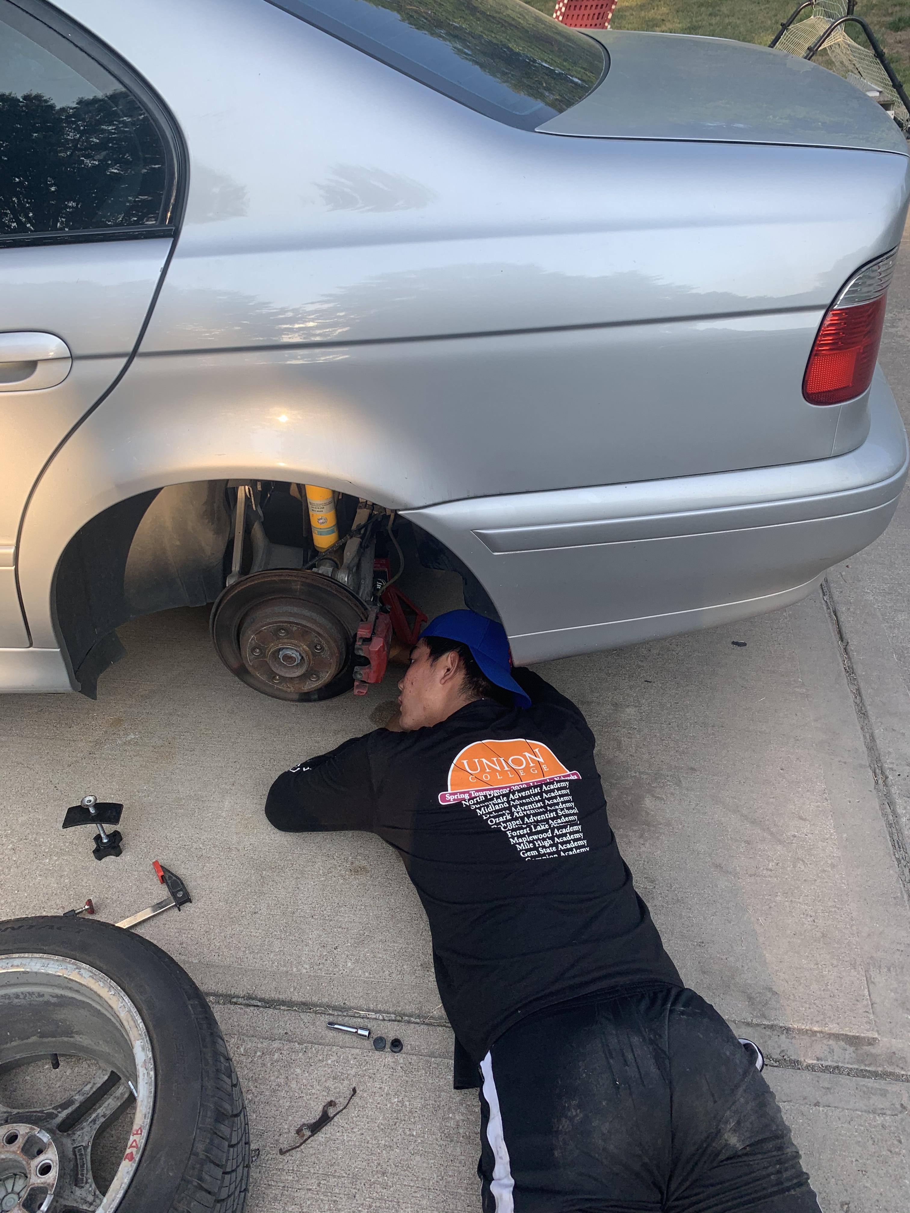 Teaching next generation love of working on the e39! 250k brake job