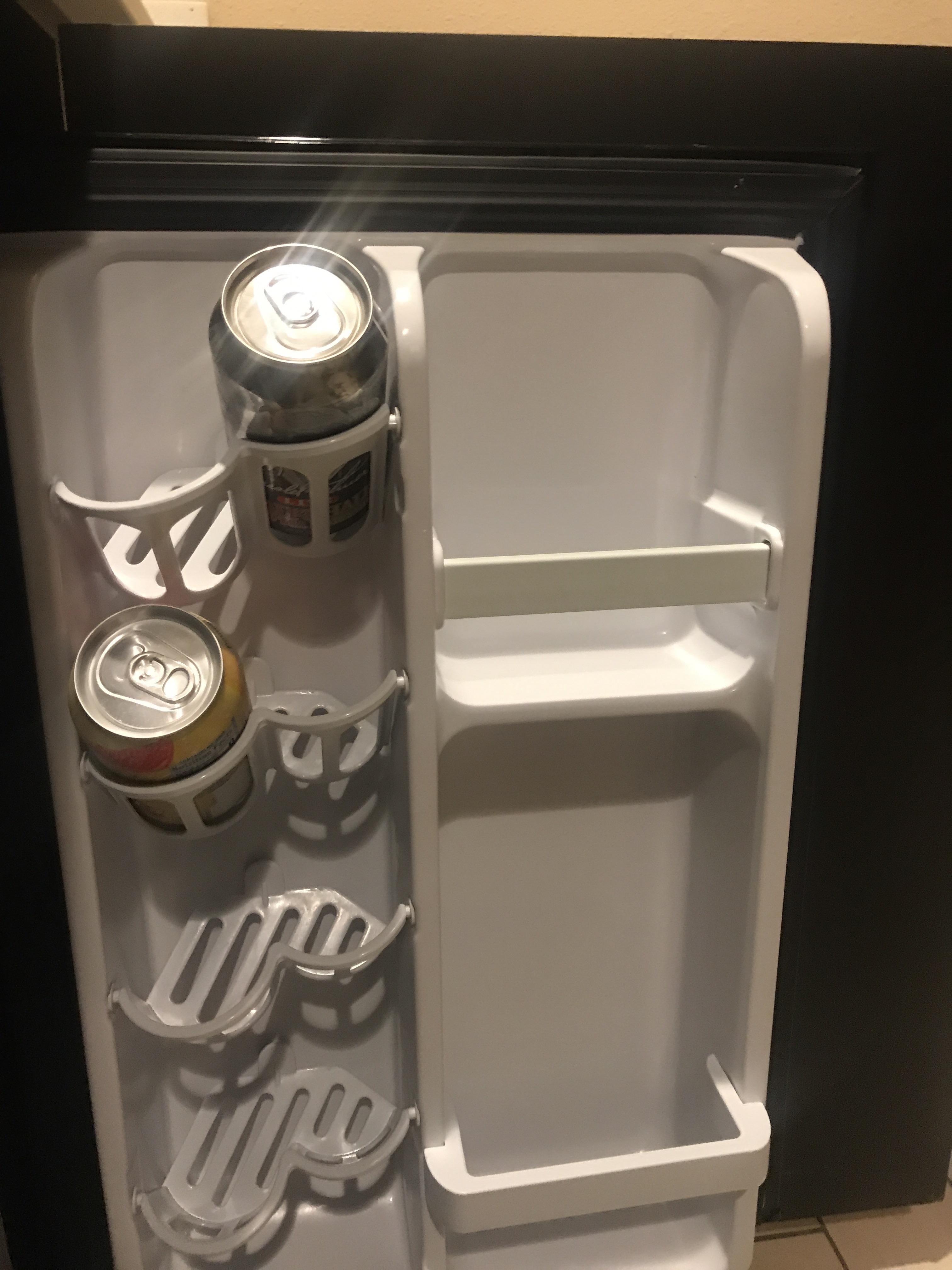 This Hotel Refrigerator has a section for a can holders r