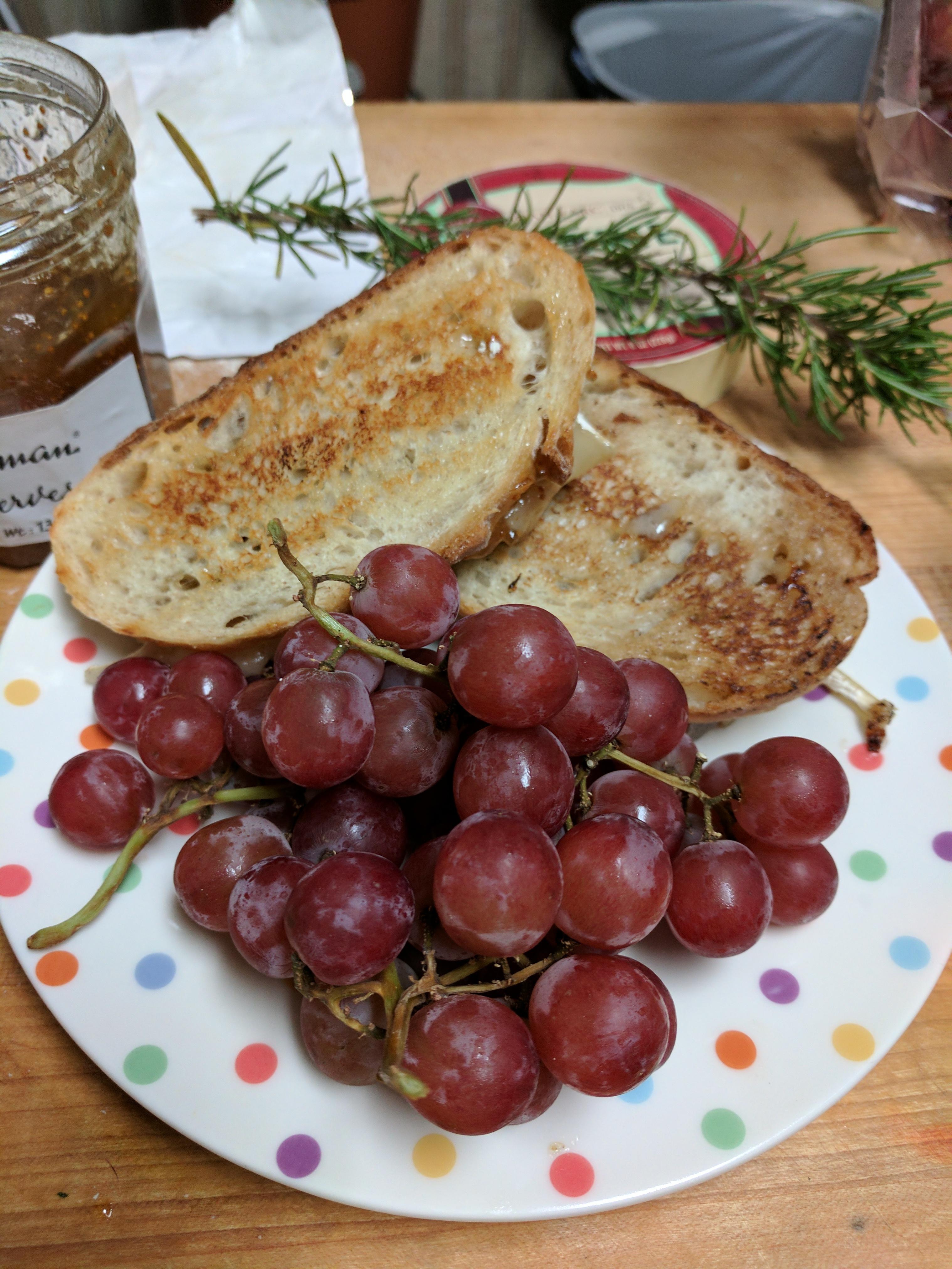 Brie and fig preserves with rosemary on country French bread r