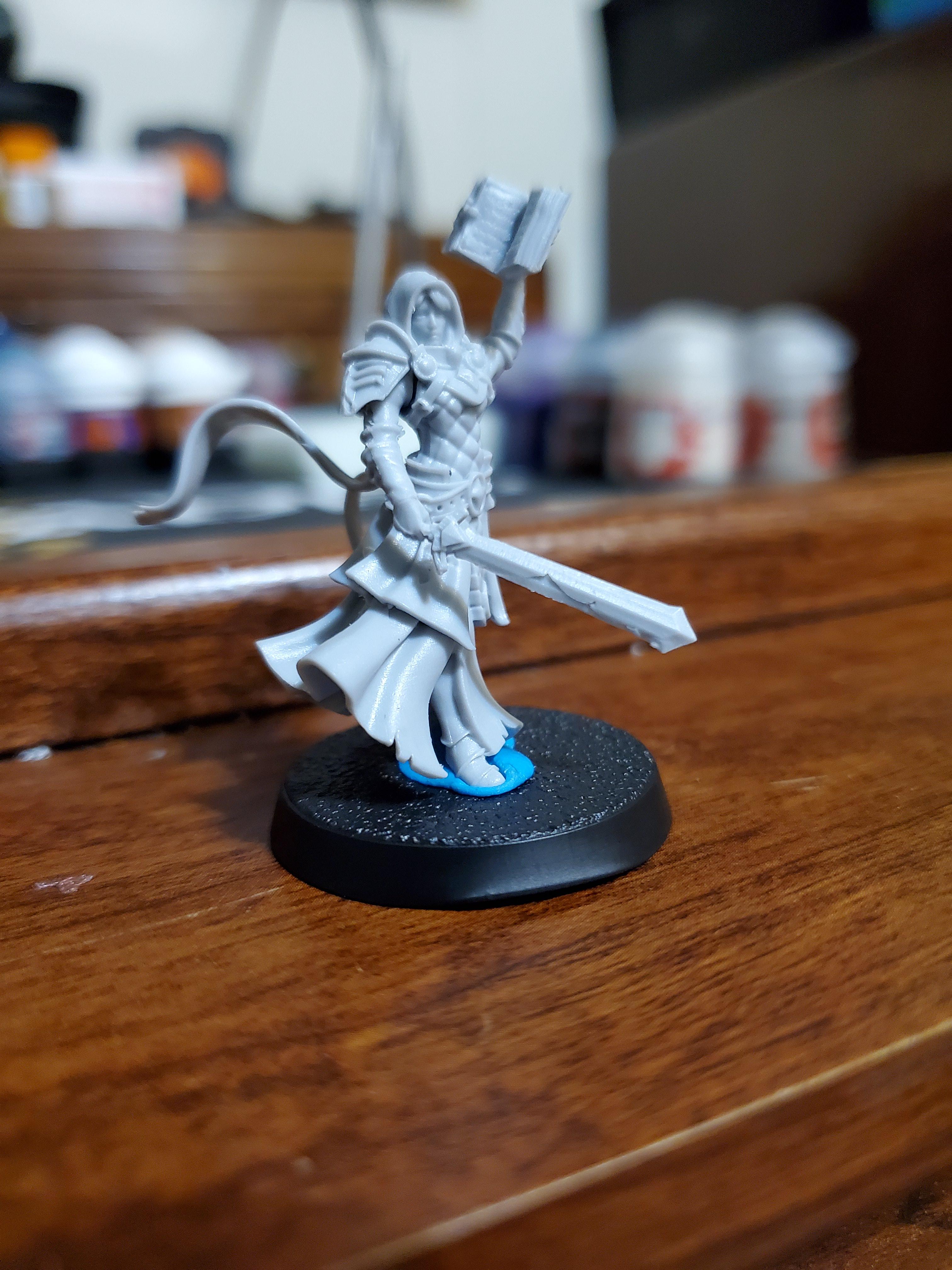 Miniature is resin and the sword is chipped on the blade. Wbats the