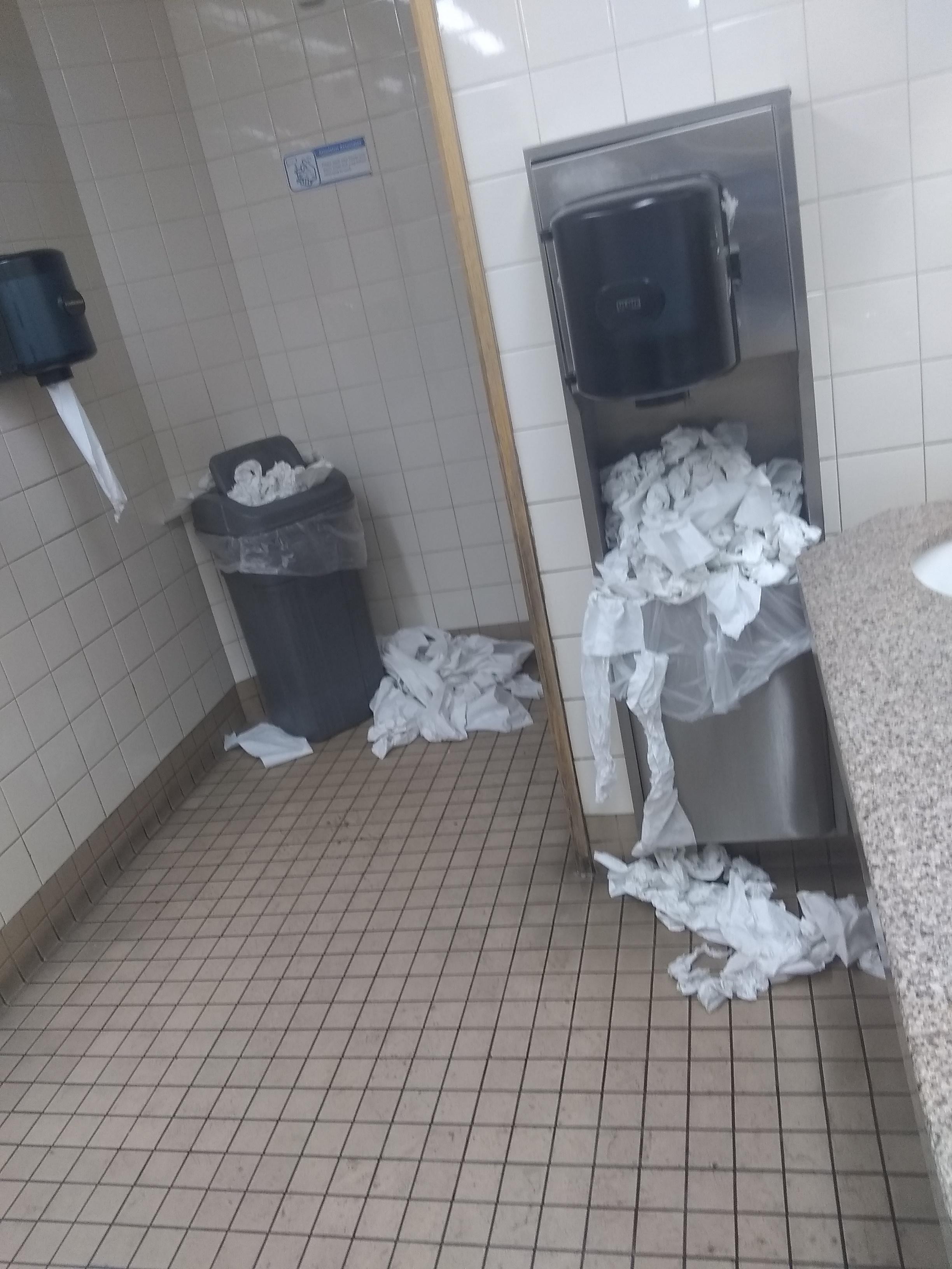 The bathroom of a Walmart I'm visiting. trashy