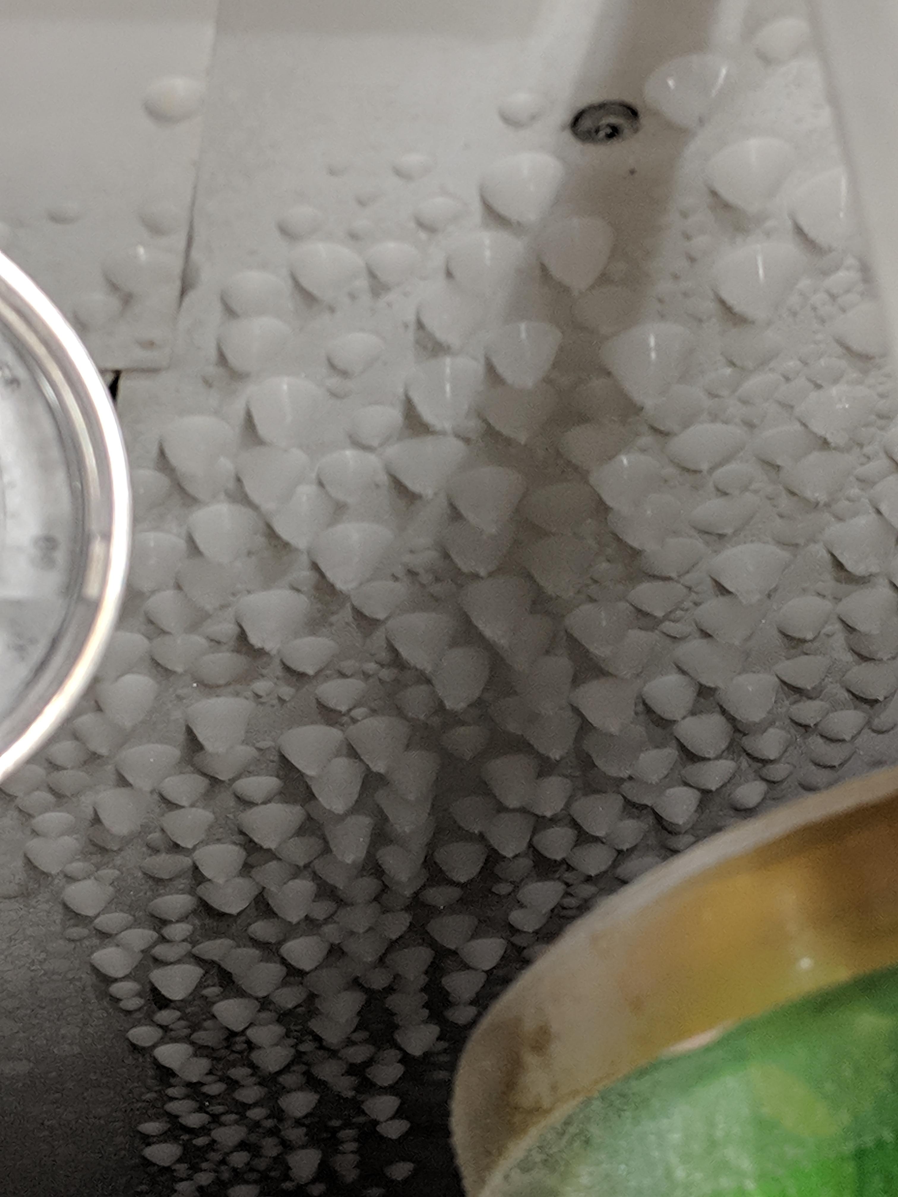 Frozen condensation droplets on the top of my freezer r/mildlyinteresting