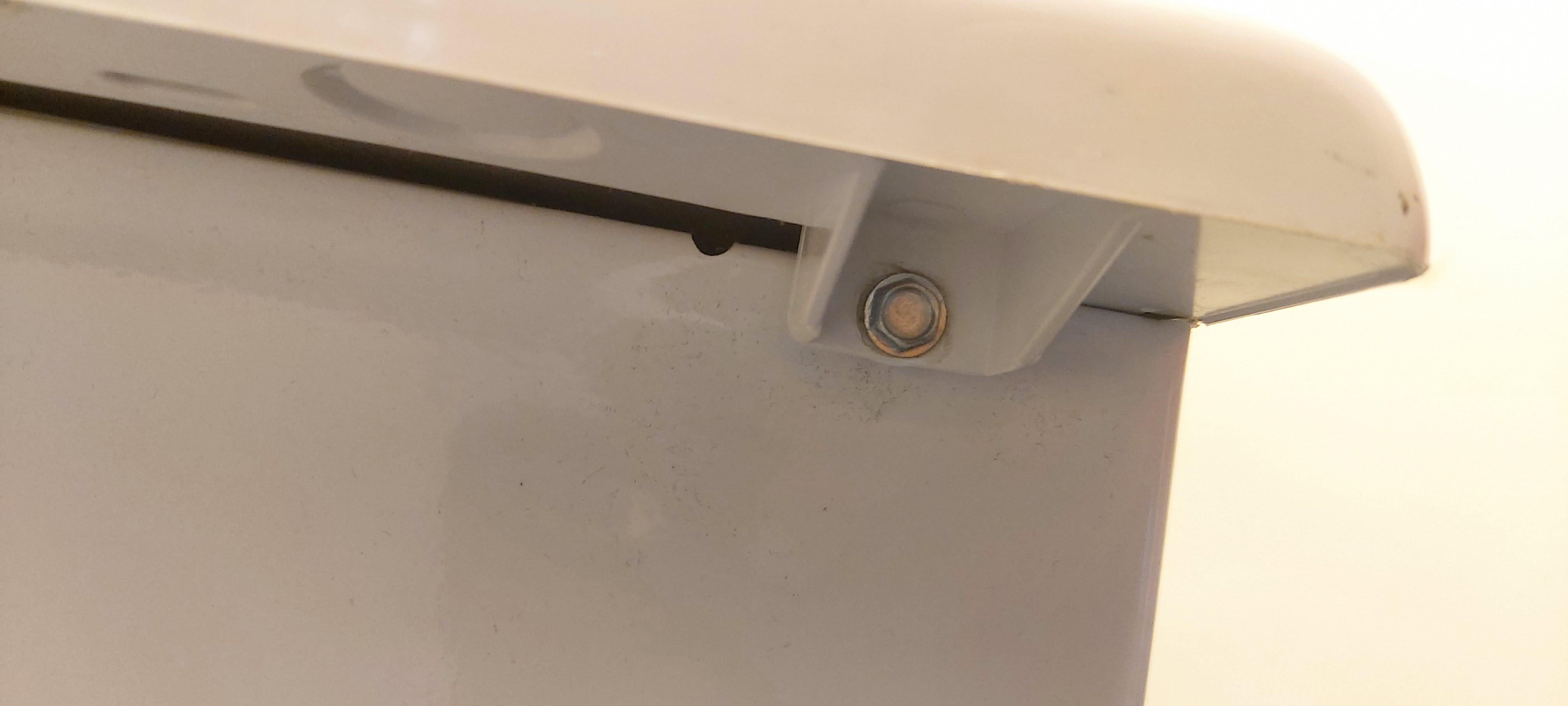 how to unscrew these screws? other side is under the dryer top which I