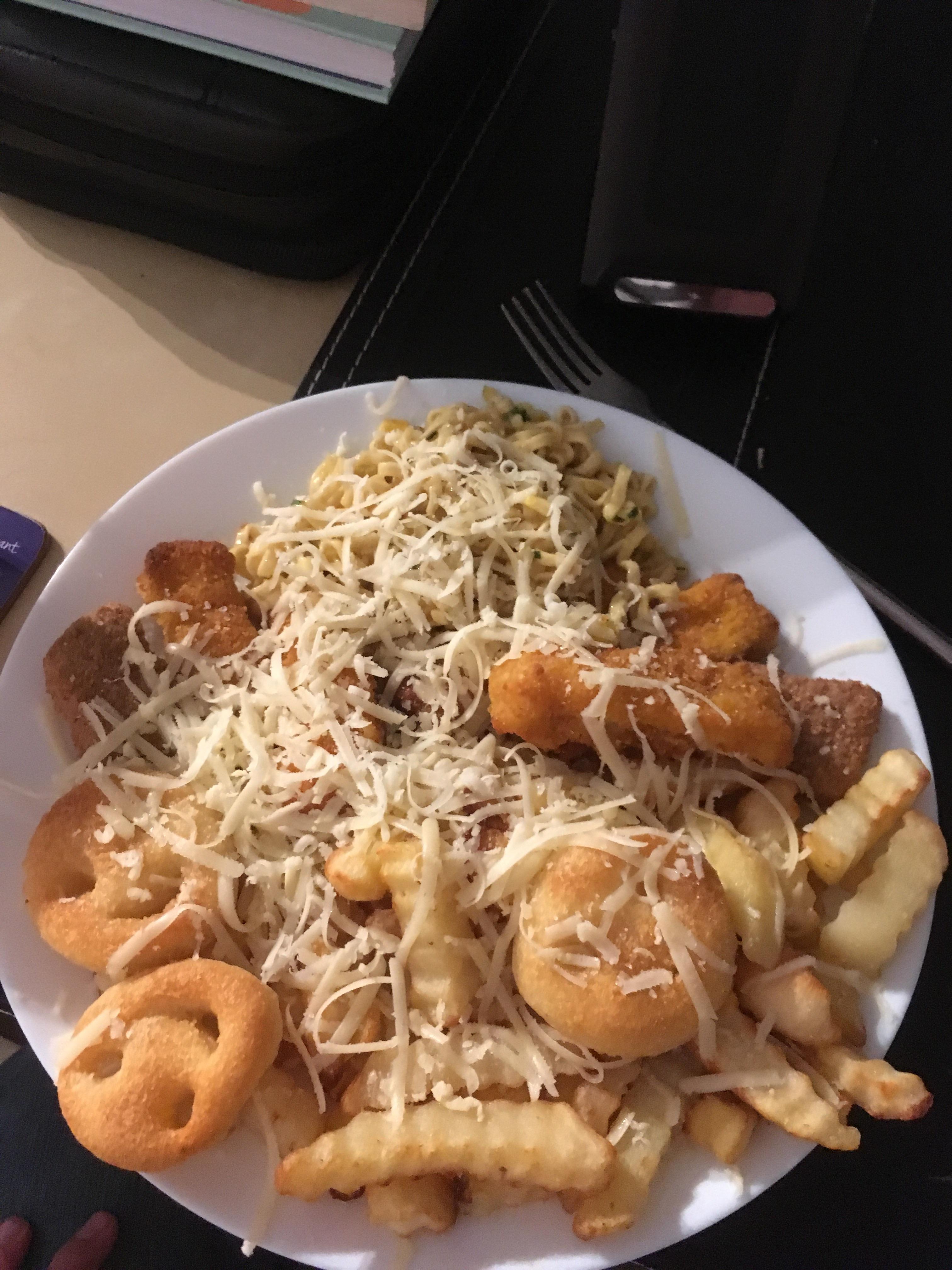 My dinner pot noodle, chips, fish fingers , smiley faces and chicken