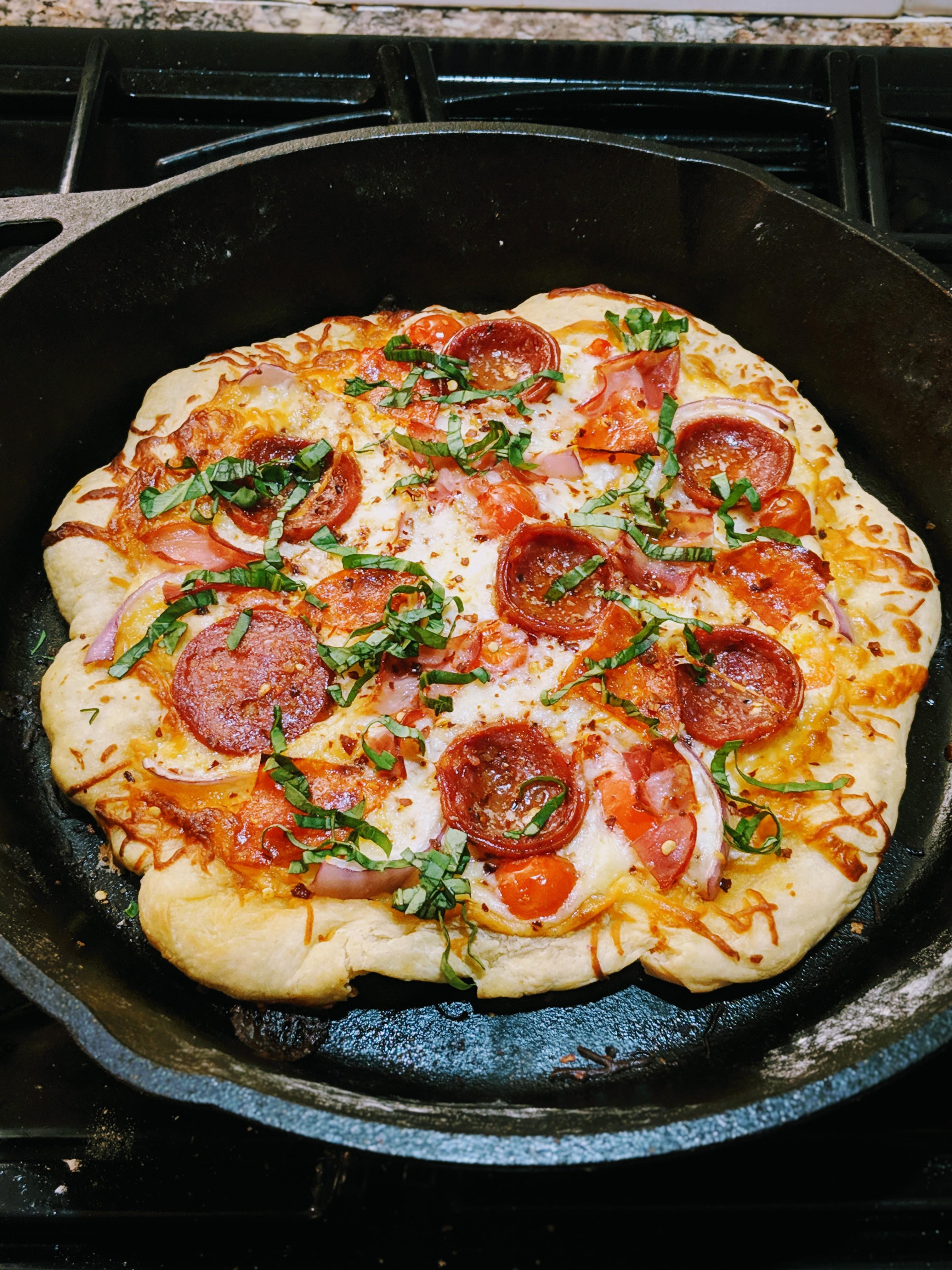 First attempt at cast iron pizza. Looking to improve. r/Pizza