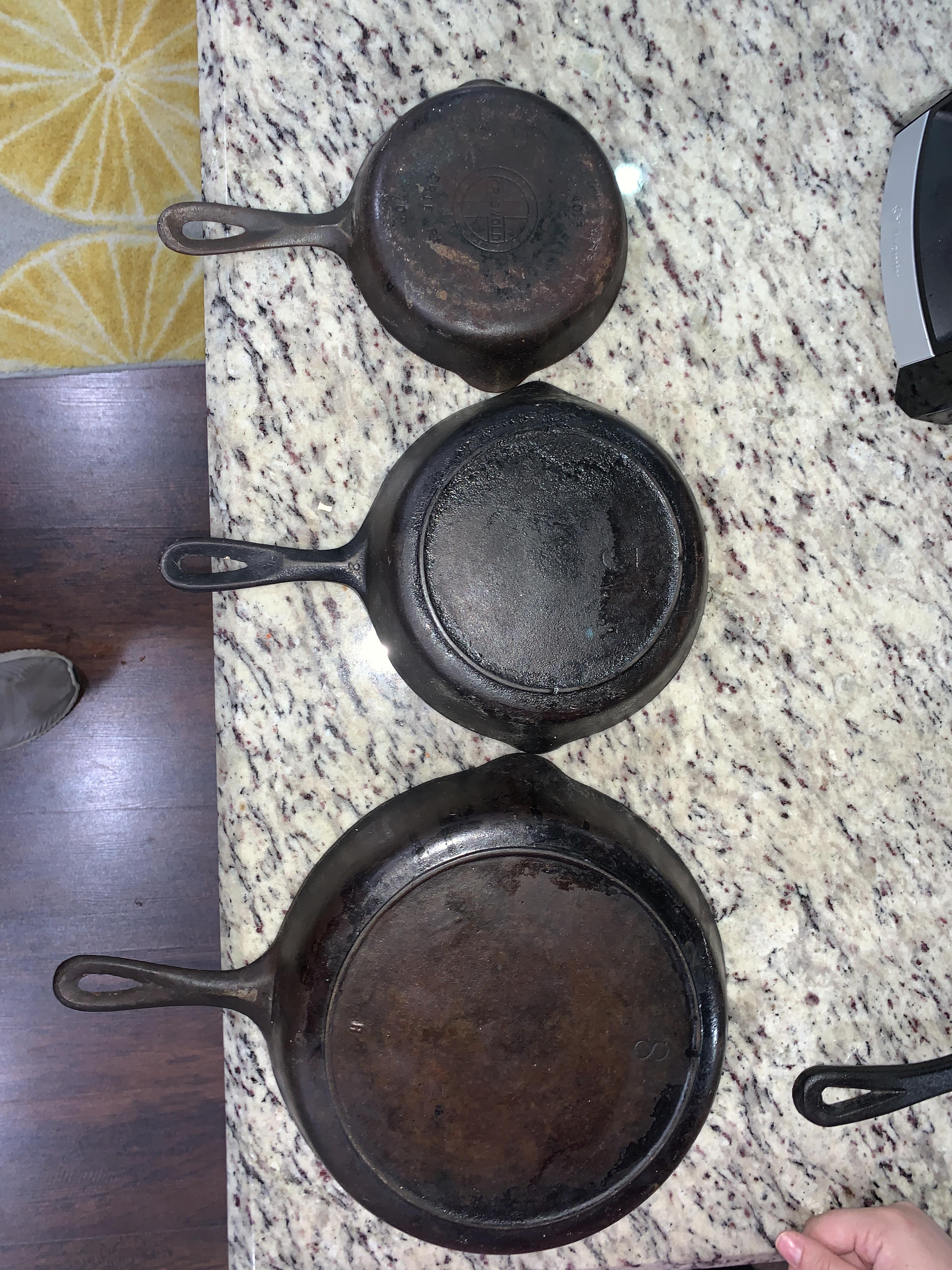 Inherited some old family heirlooms! Top is a Griswold 3 any ideas on