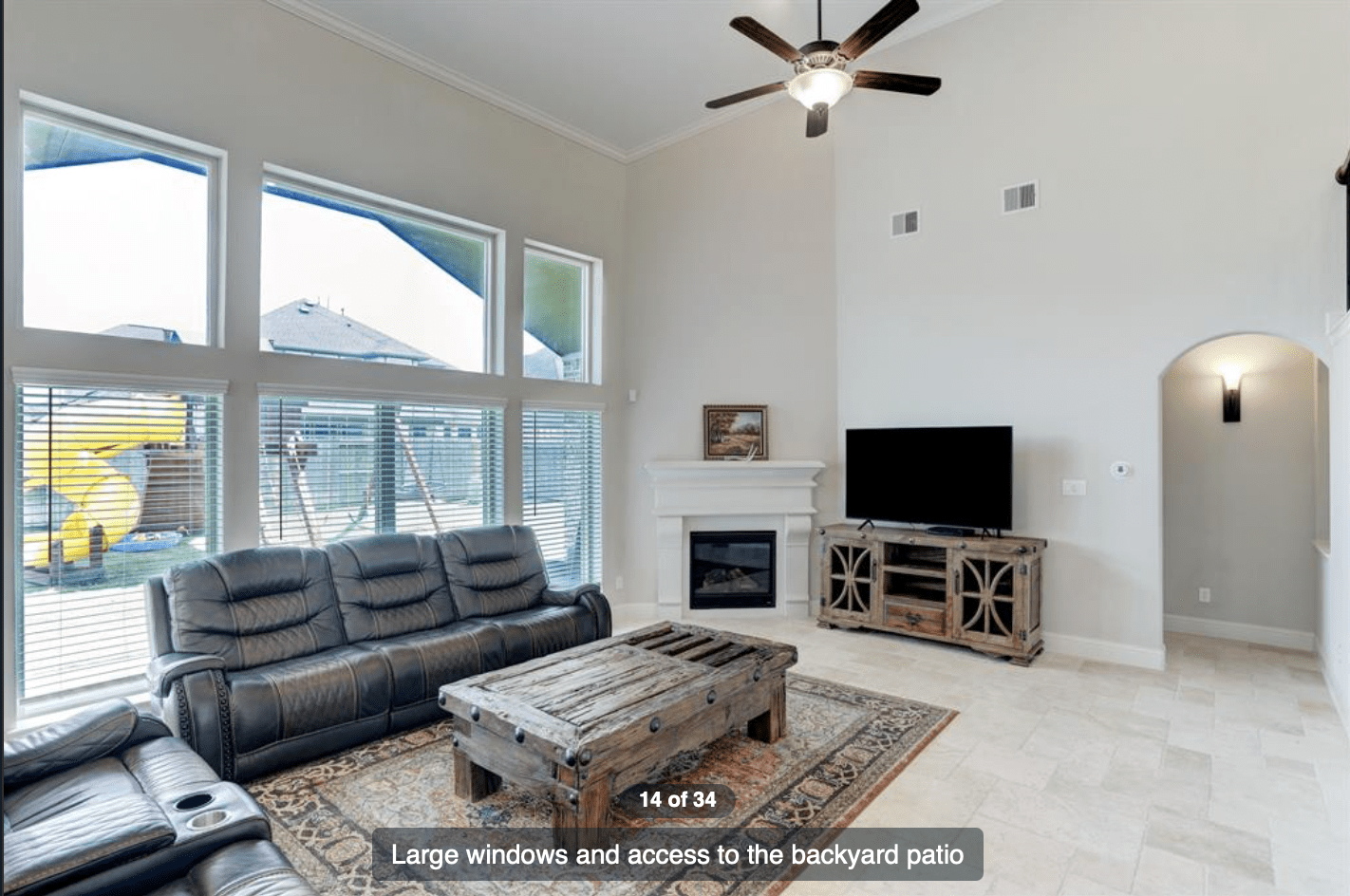 Accent wall behind fireplace with stone ledger, does the travertine