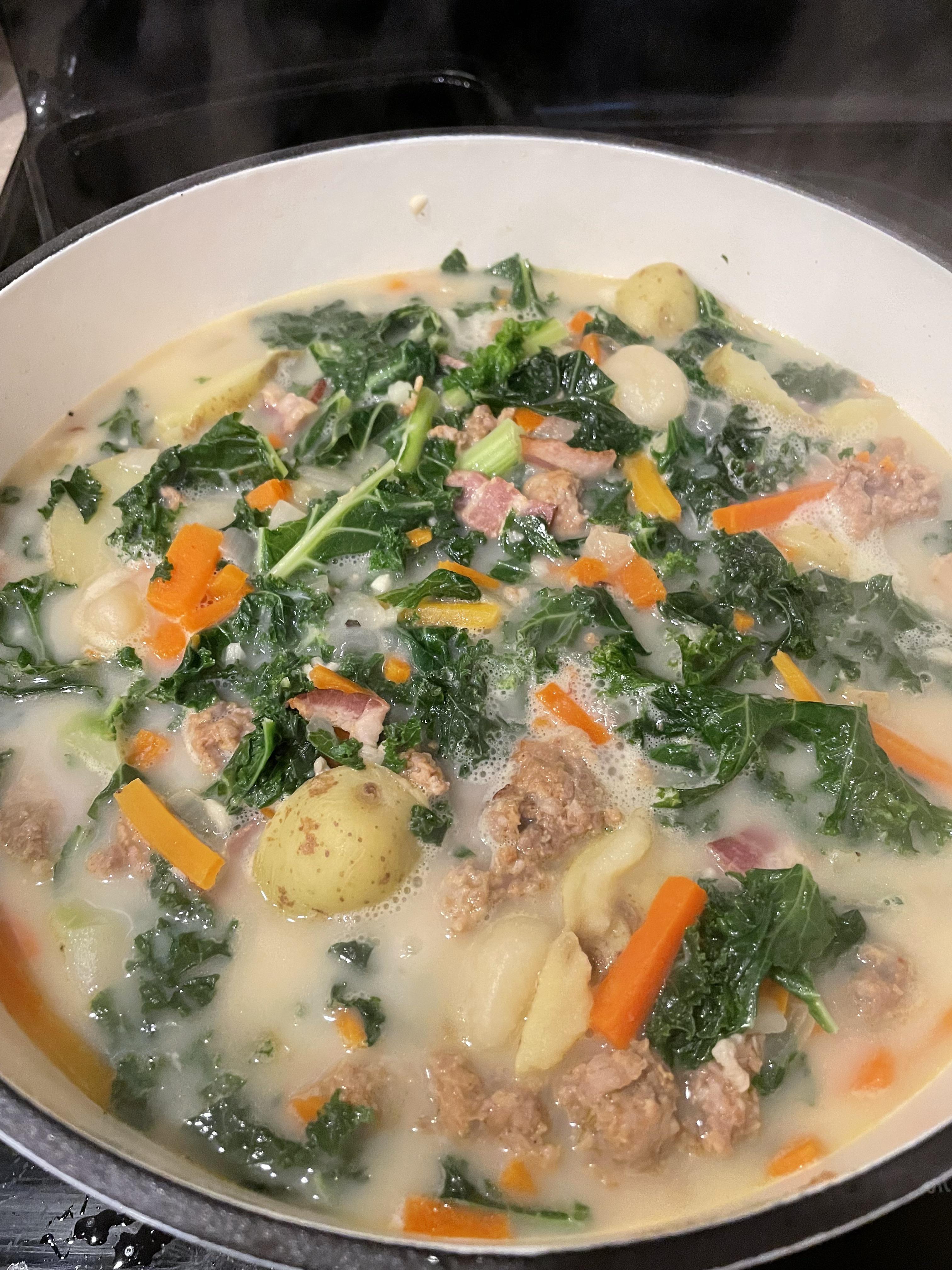 Breaking in the Dutch oven with Zuppa Toscana soup, modified to include