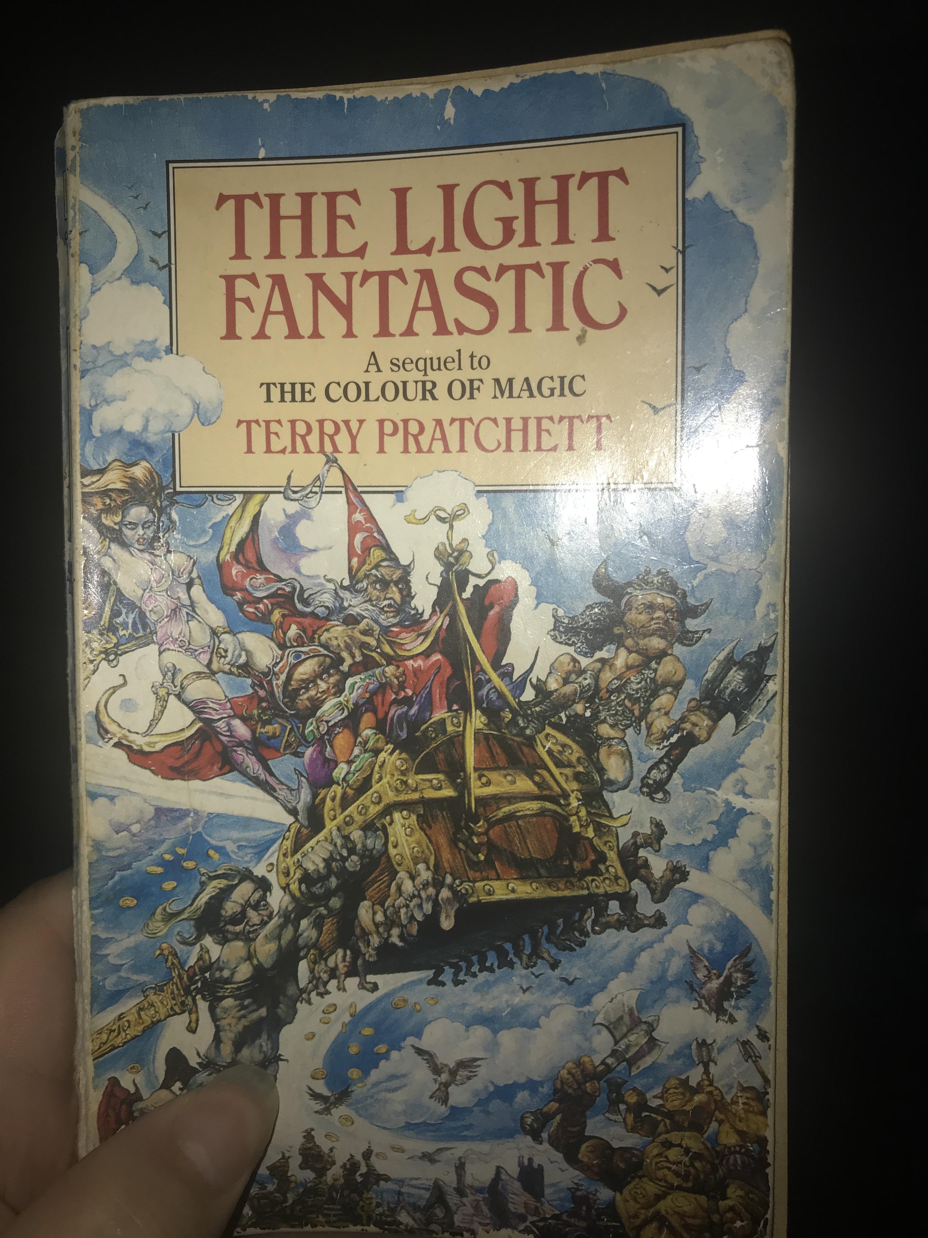 Who are the people on the cover of the light fantastic? discworld