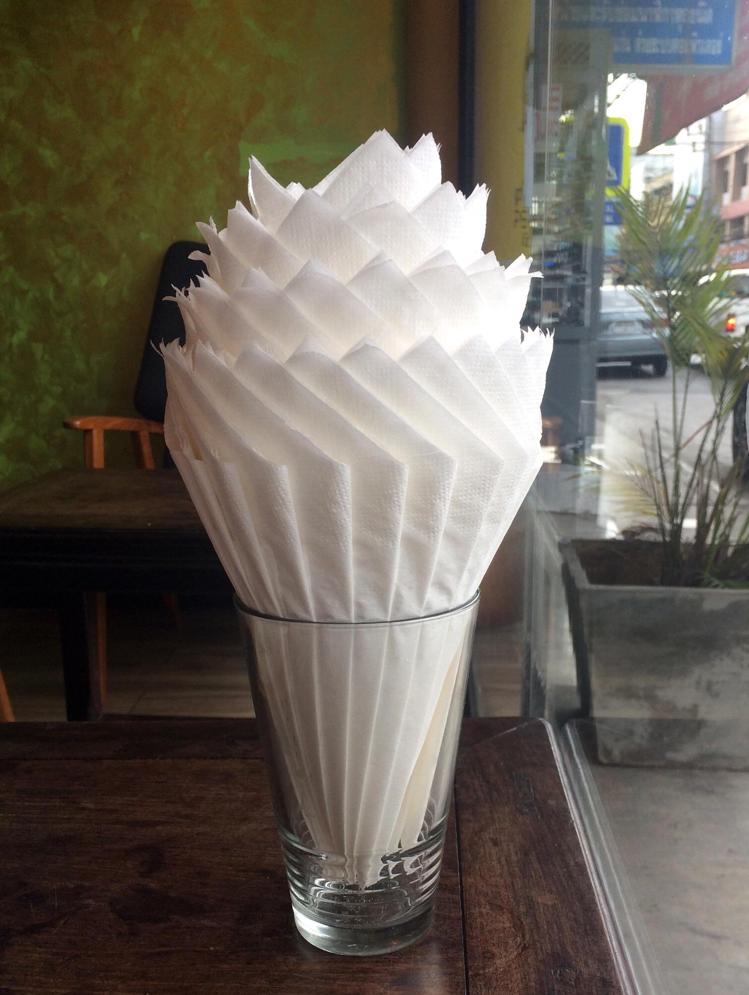 These napkins in a glass are arranged to look like a milkshake r