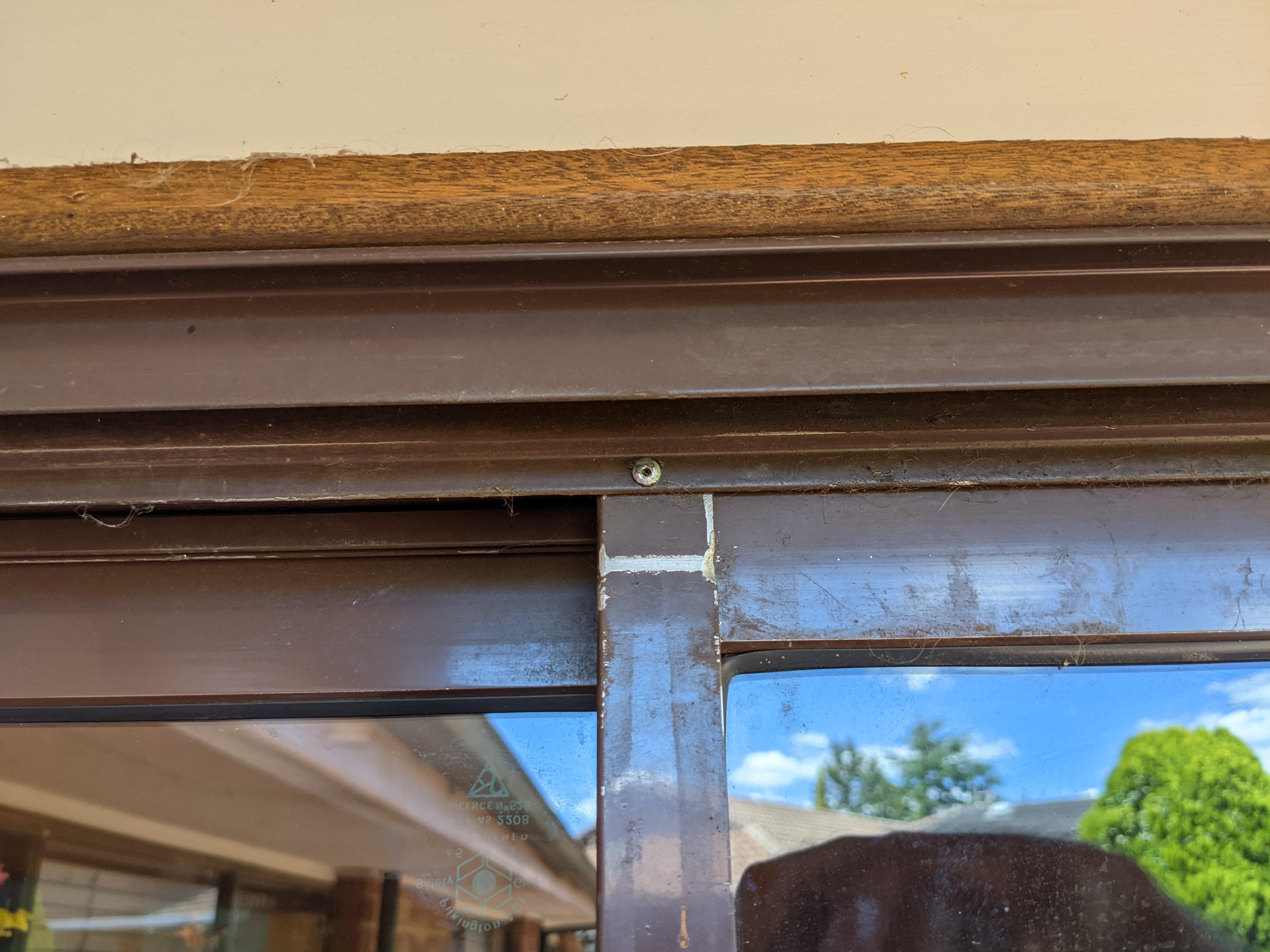 I'm trying to remove my sliding door to replace the rollers, but I can