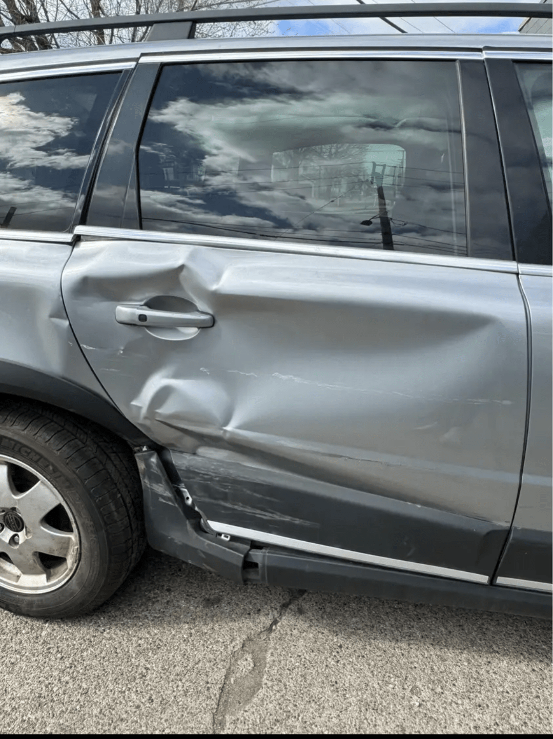 2012 Volvo xc70 side door damage. how much would a body shop charge to