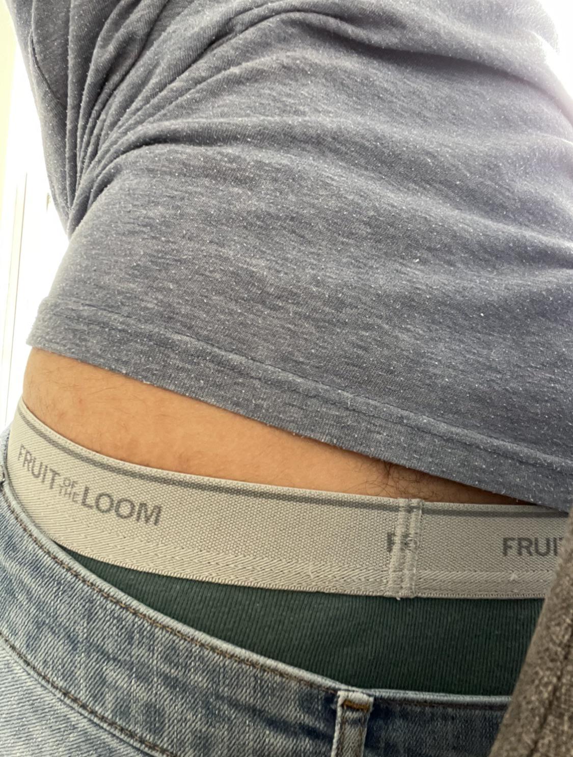 You see me sitting at the DMV. I lean forward looking at my phone, and