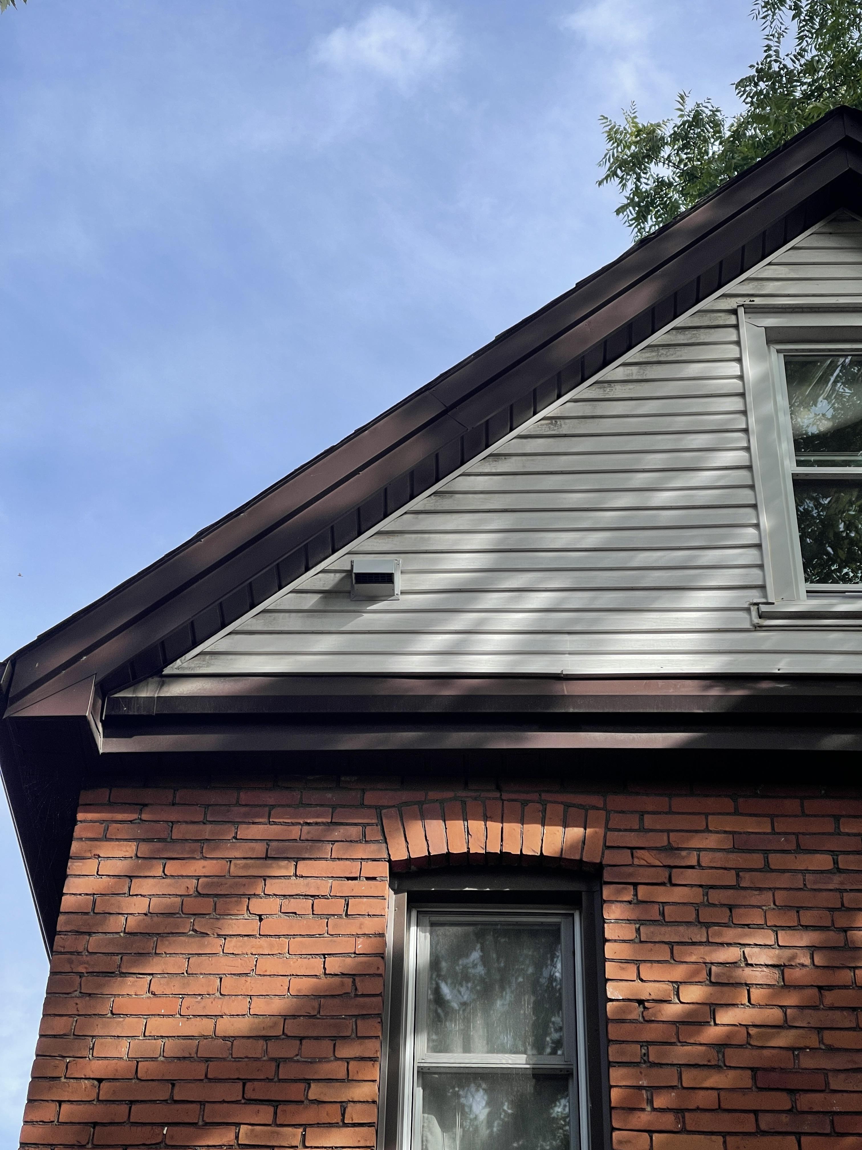 Is this bathroom fan exhaust vent too close to the soffit? In the north