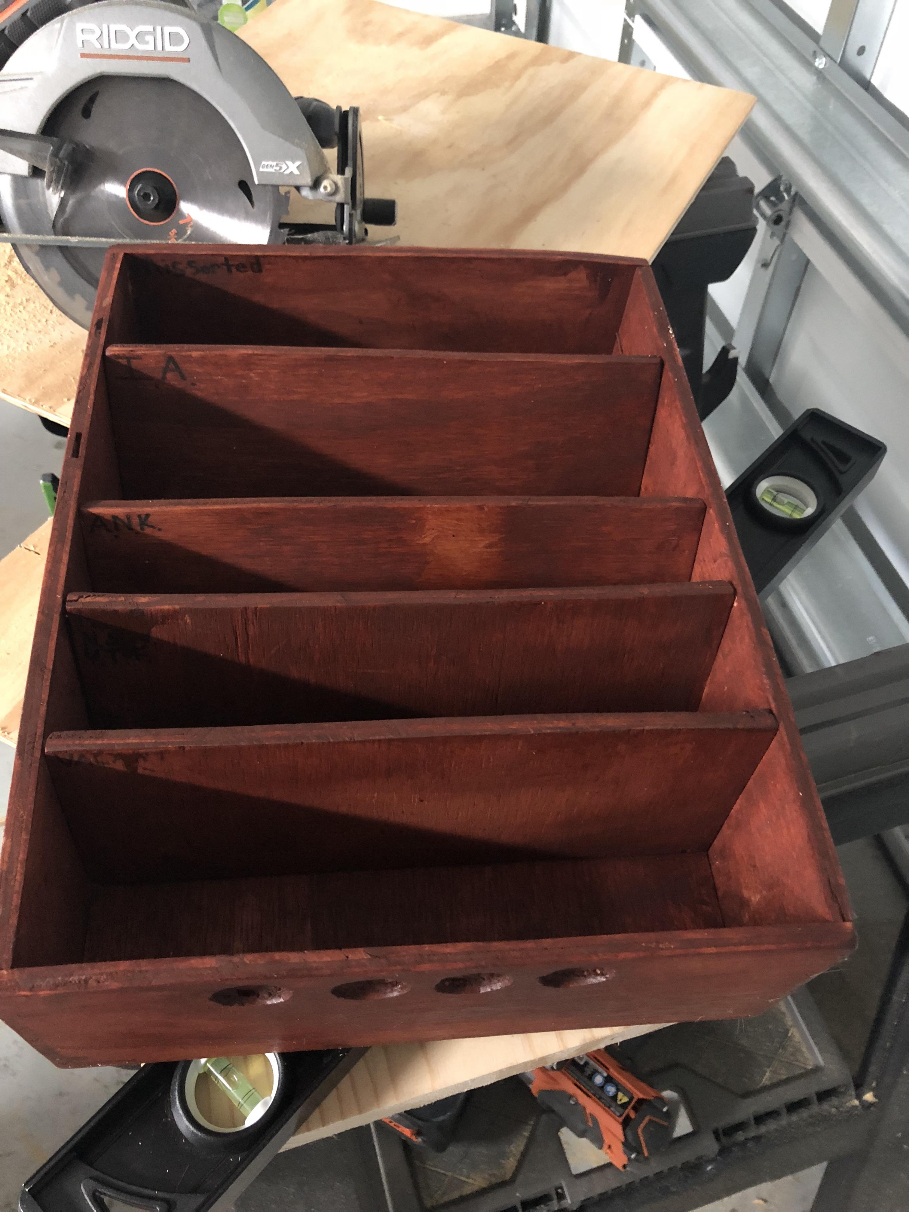 I built my own wooden tray with slots of various size according to what