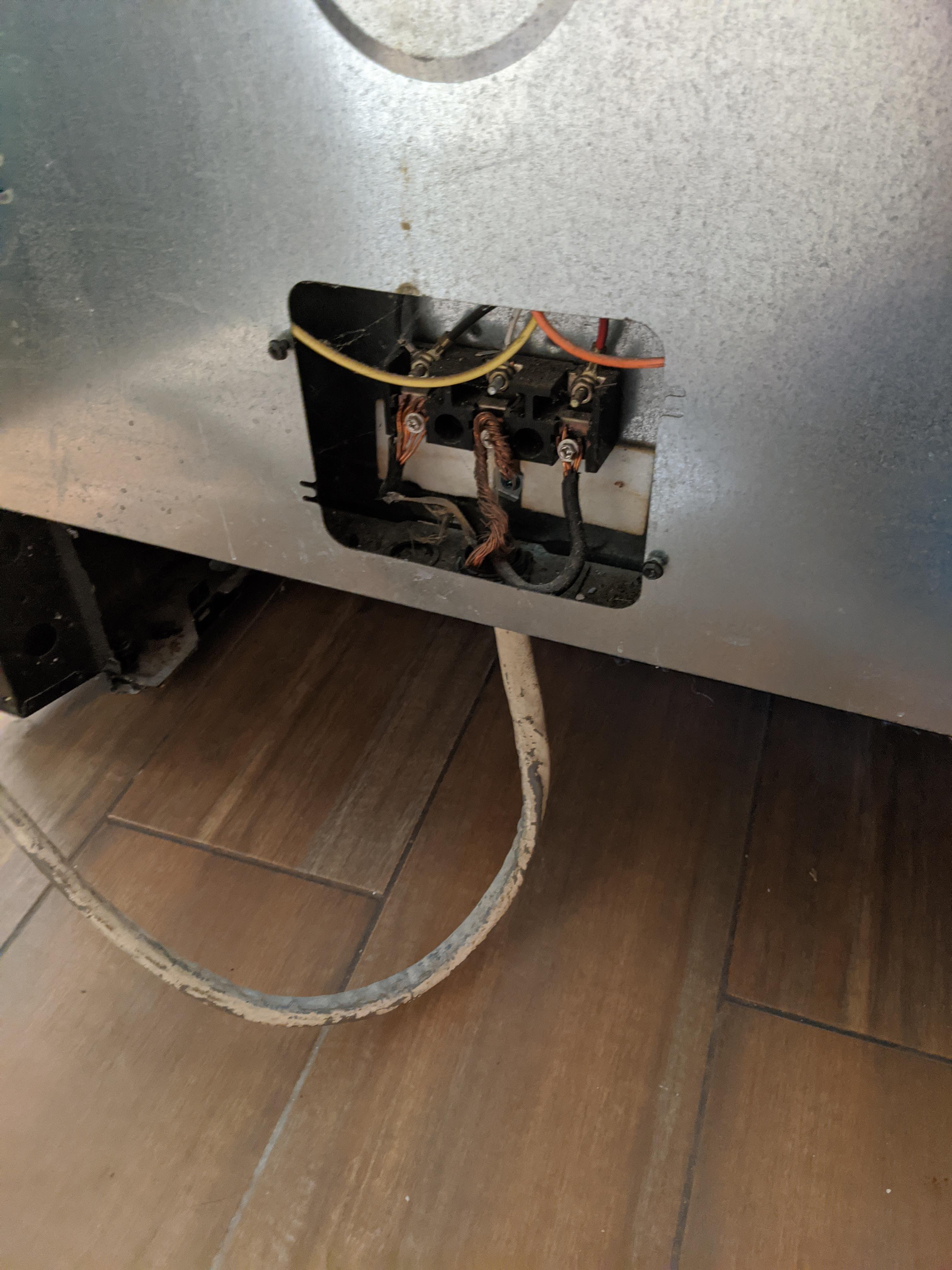 Stove hardwired with 668 SE cable and no cover. This seems fine, right? The conductors almost
