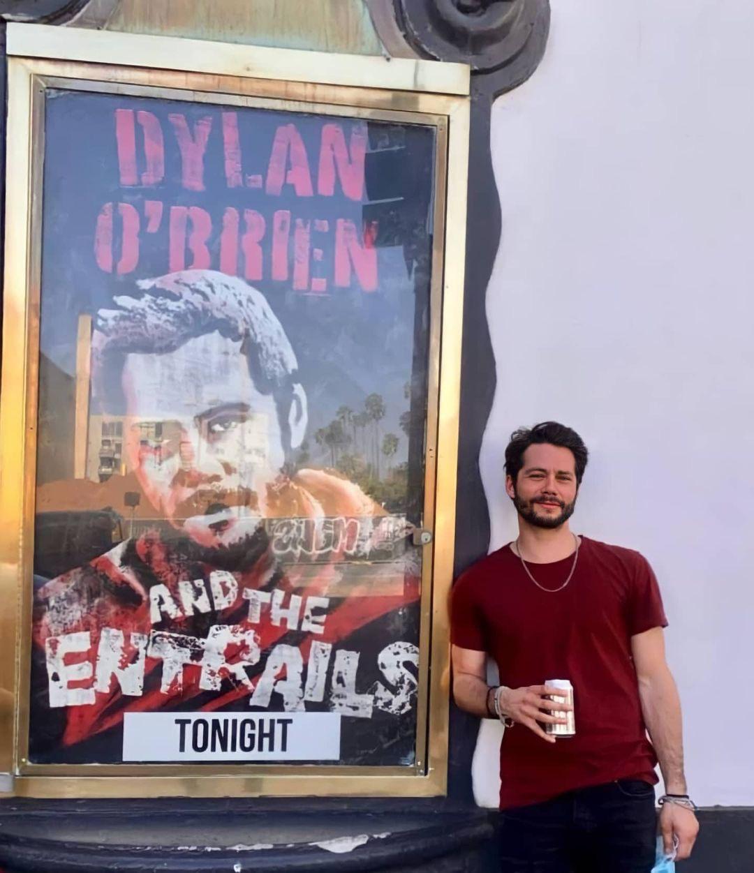 Dylan with his “Dylan O’Brien and The Entrails” poster from Curb Your