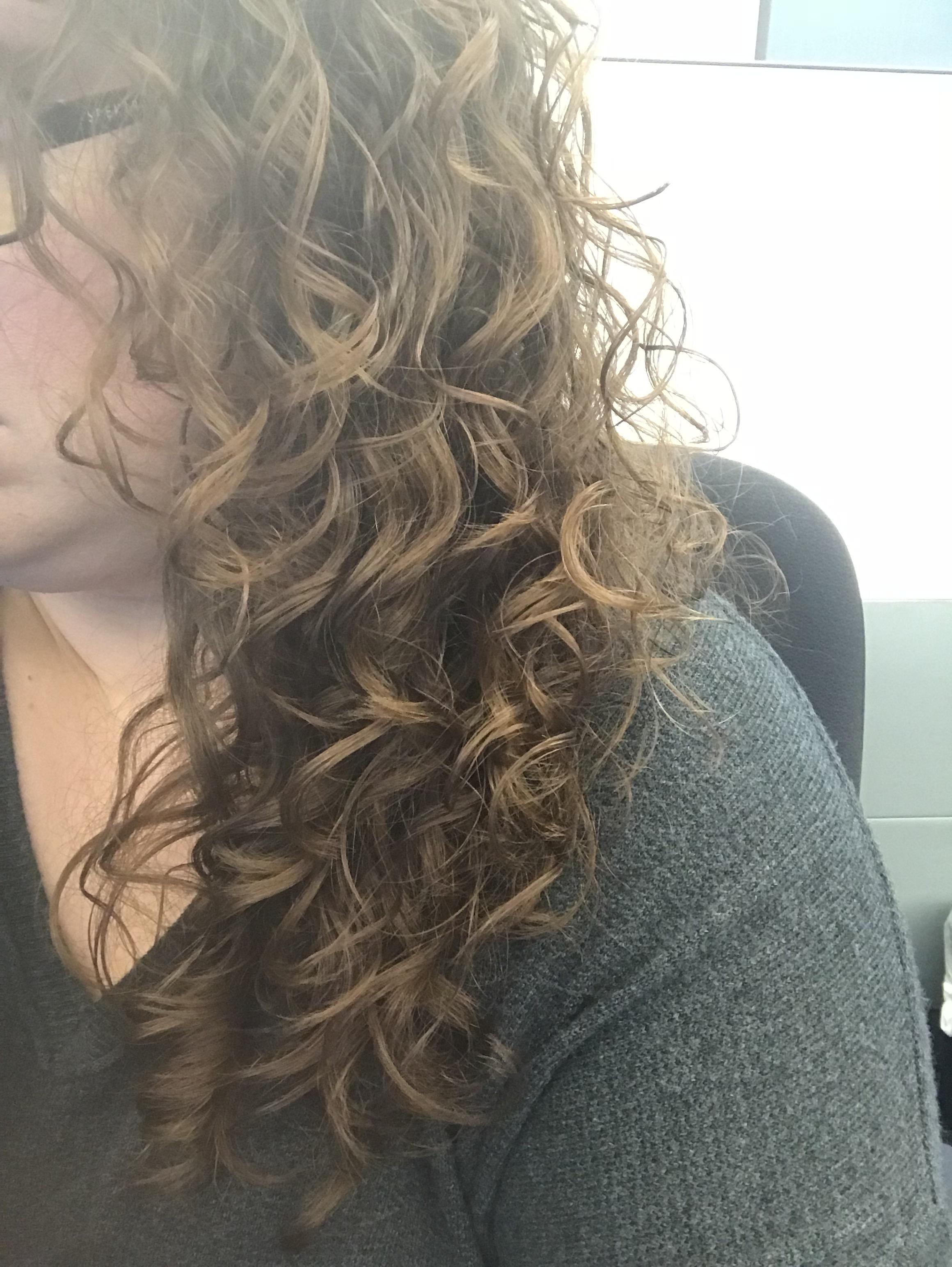 Adding gel to soaking wet hair upside down and then scrunching with a