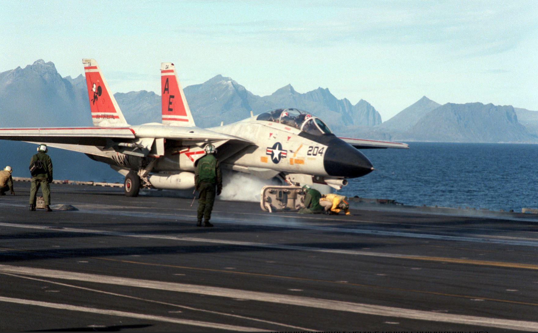 F14A Tomcat accelerates down the deck of the USS FORRESTAL (CV59