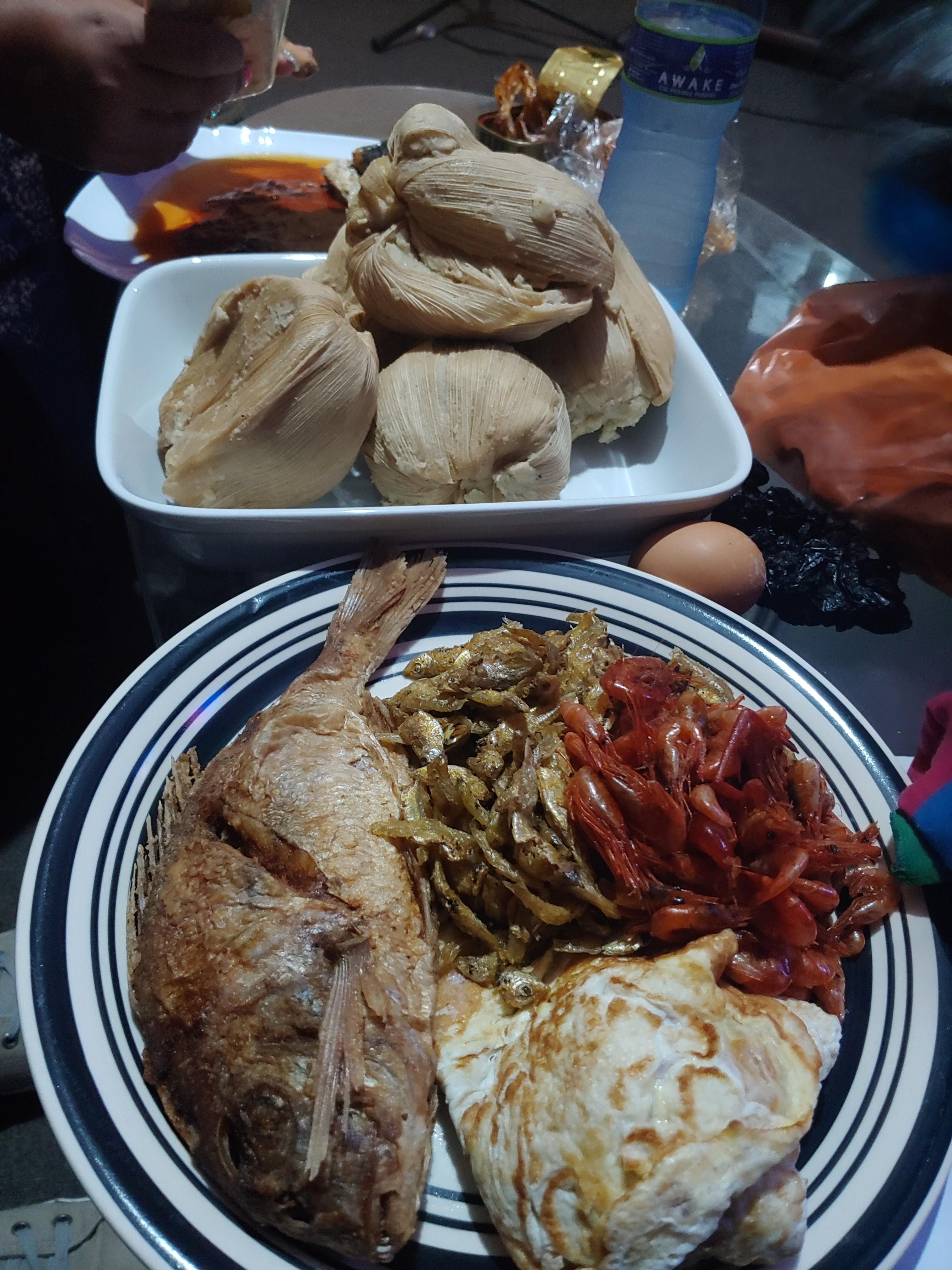 Ghanaian kenkey (dumpling made with maize) with shrimps, dried fish and