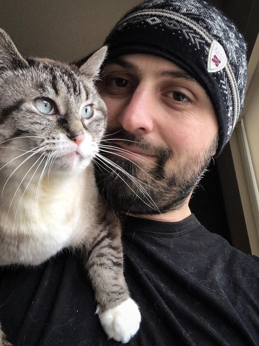 My baby loves going for rides on my shoulders! r/cats