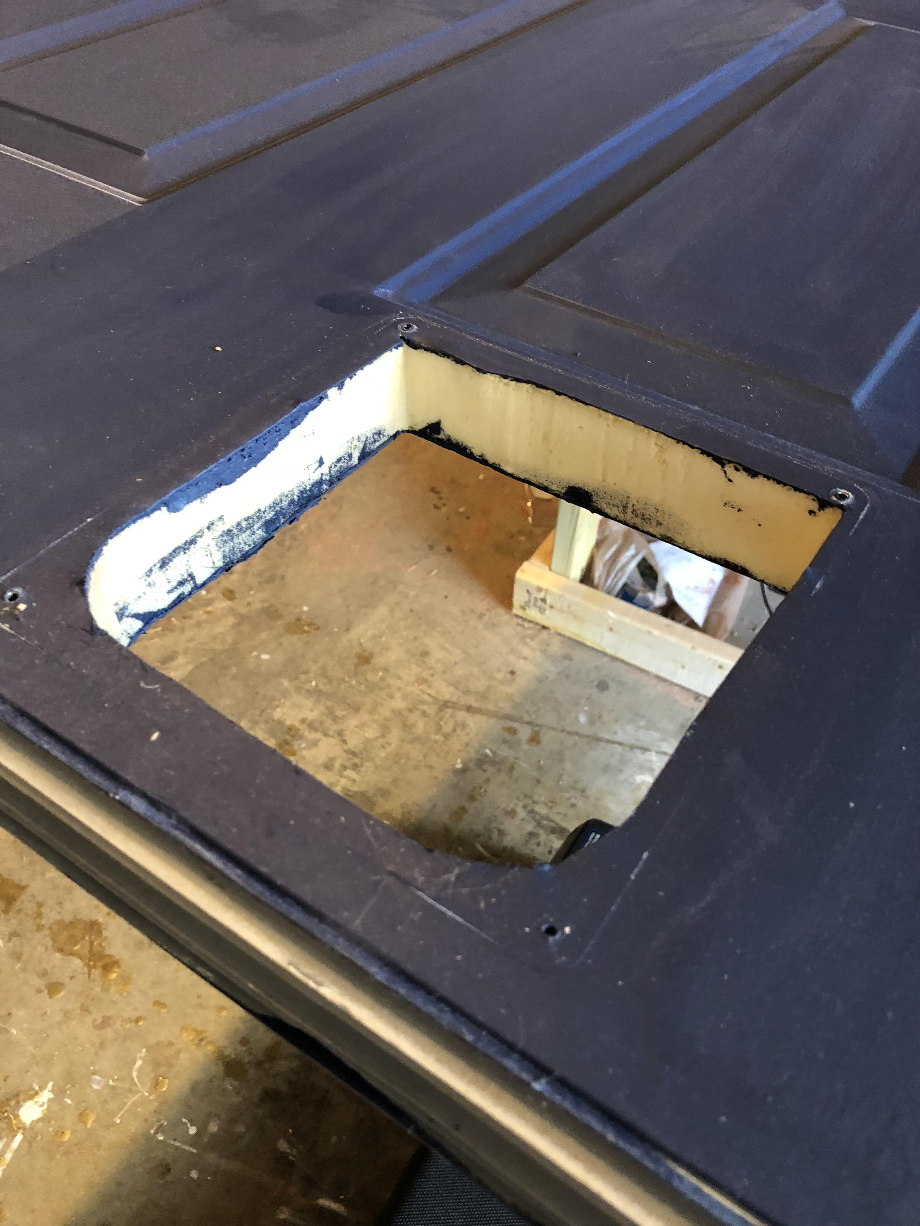 How can I repair this cat door hole or reasonably cover it up? Door is