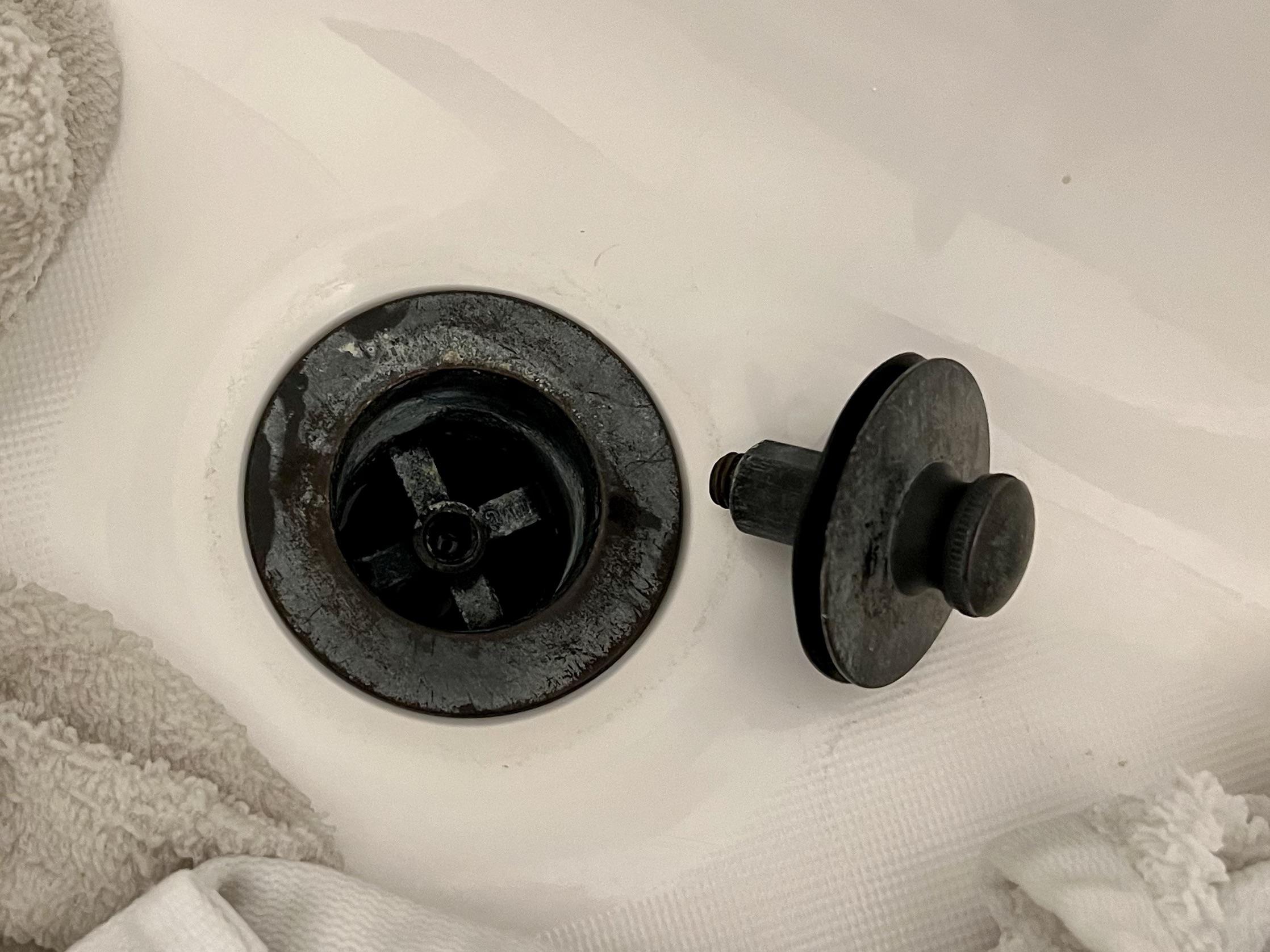 Can anybody identify this drain? New homeowners and this drain won't