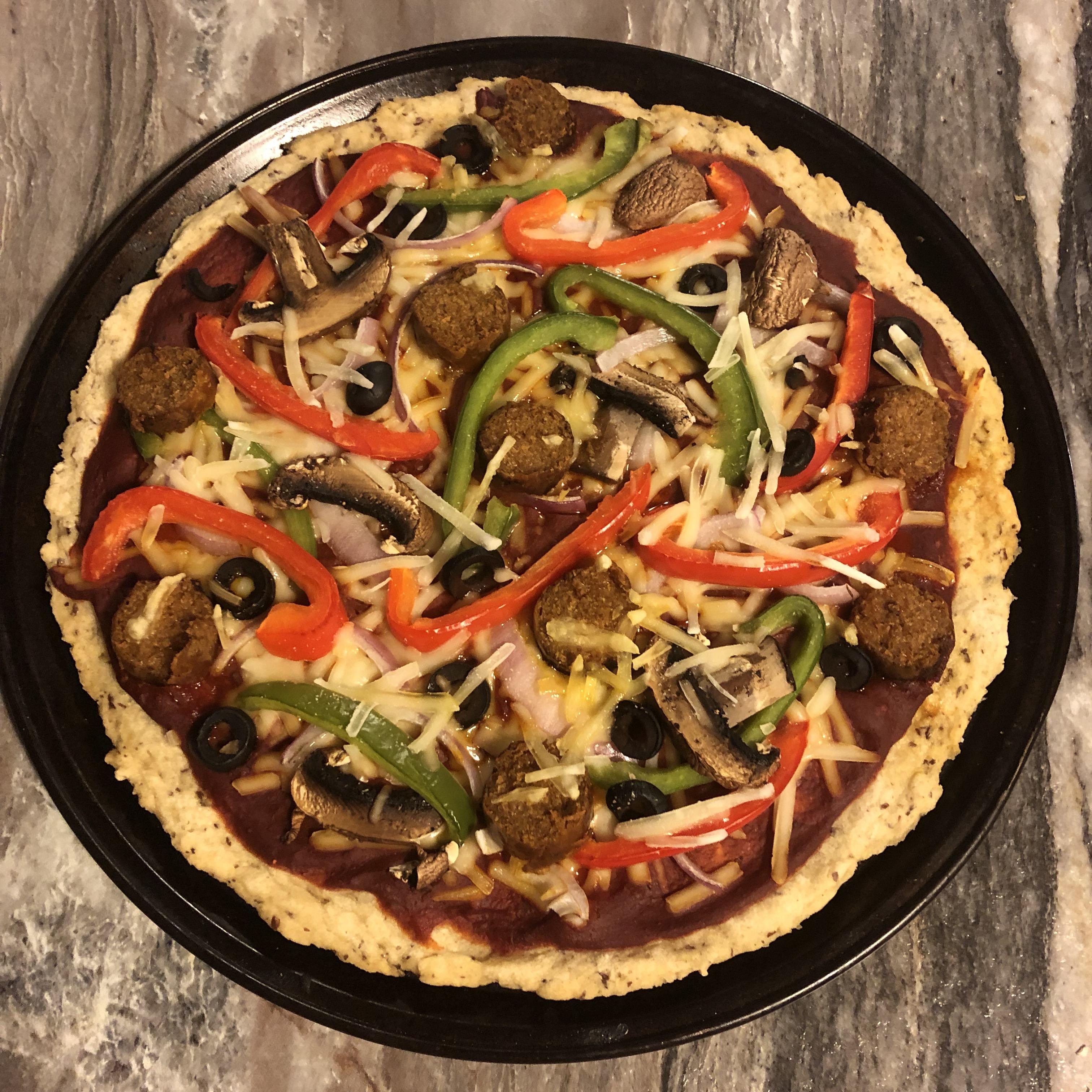 Home made gluten free veggie pizza. The sausage is beyond meat hot