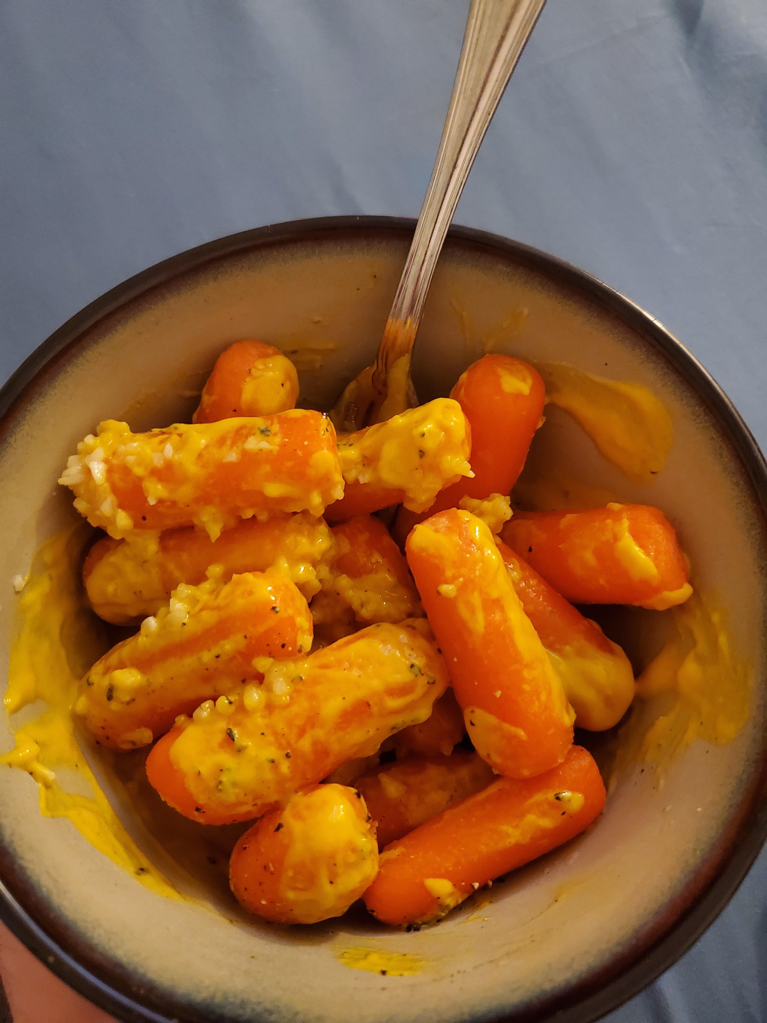 Late night healthy snack. Raw carrots with seasonings, mustard and
