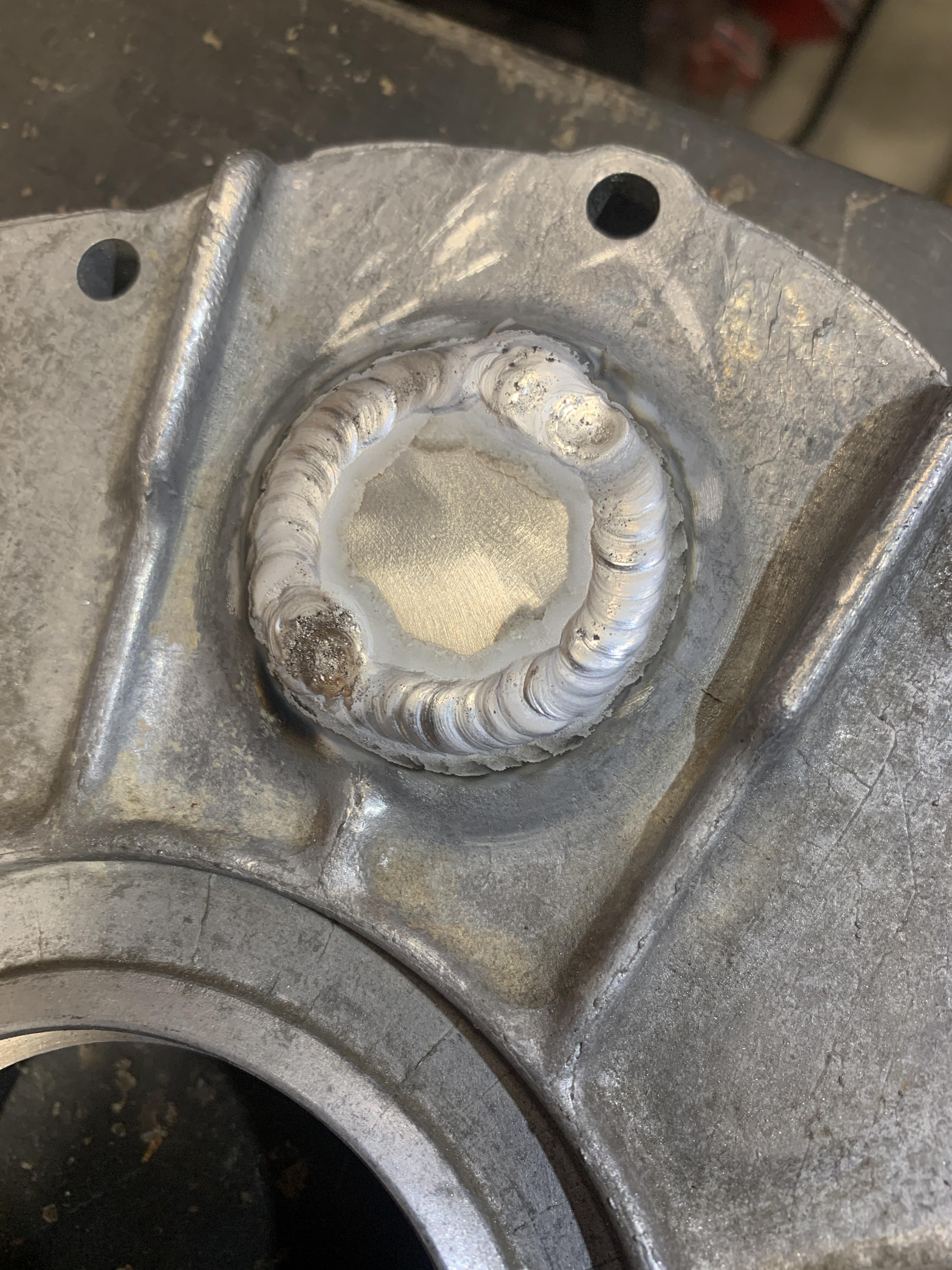 Dirty ass LT1 timing cover. Plugged the water pump hole. 150amps, 15pps