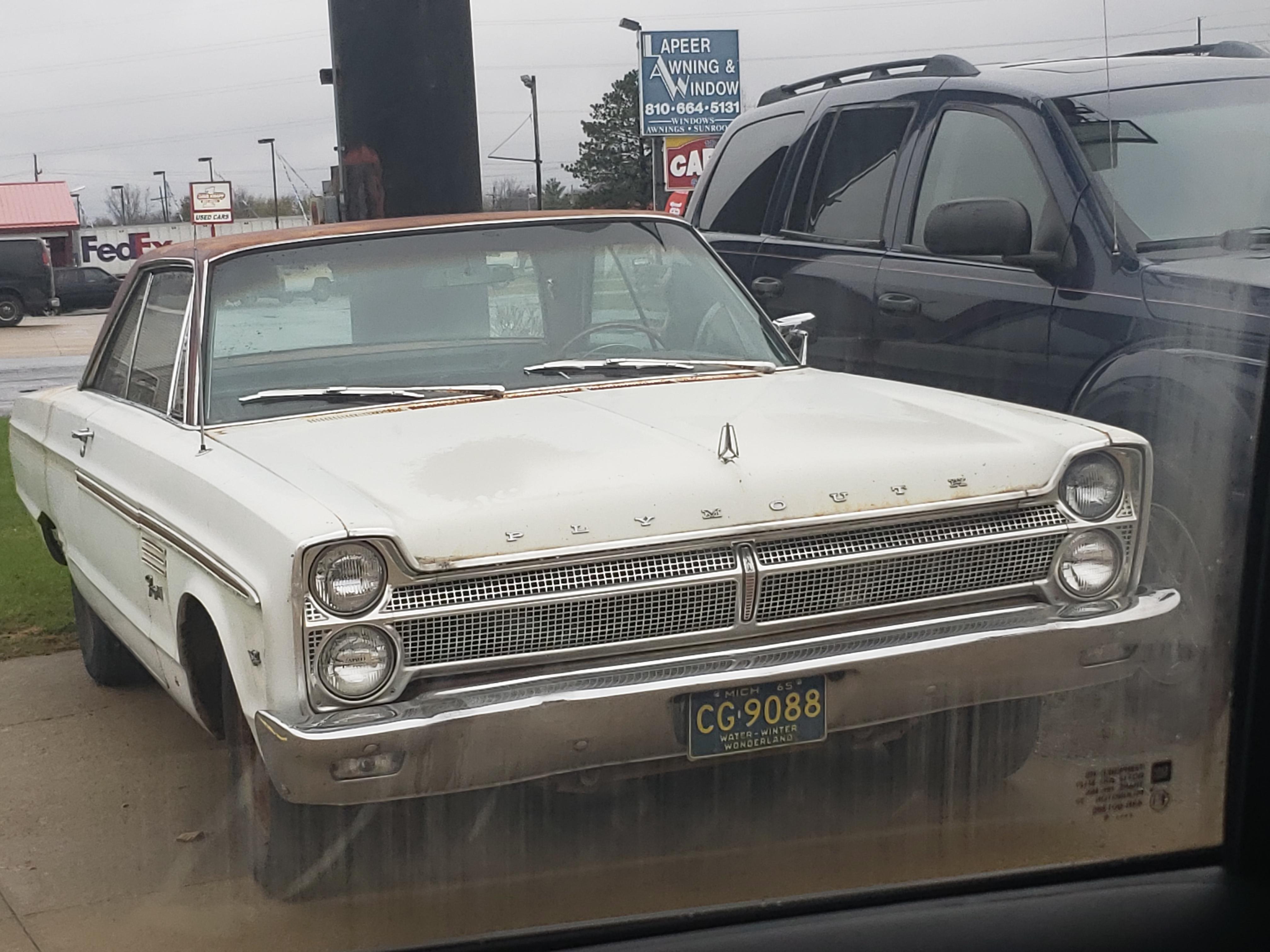 This '65 Plymouth at an auto repair shop r/mildlyinteresting