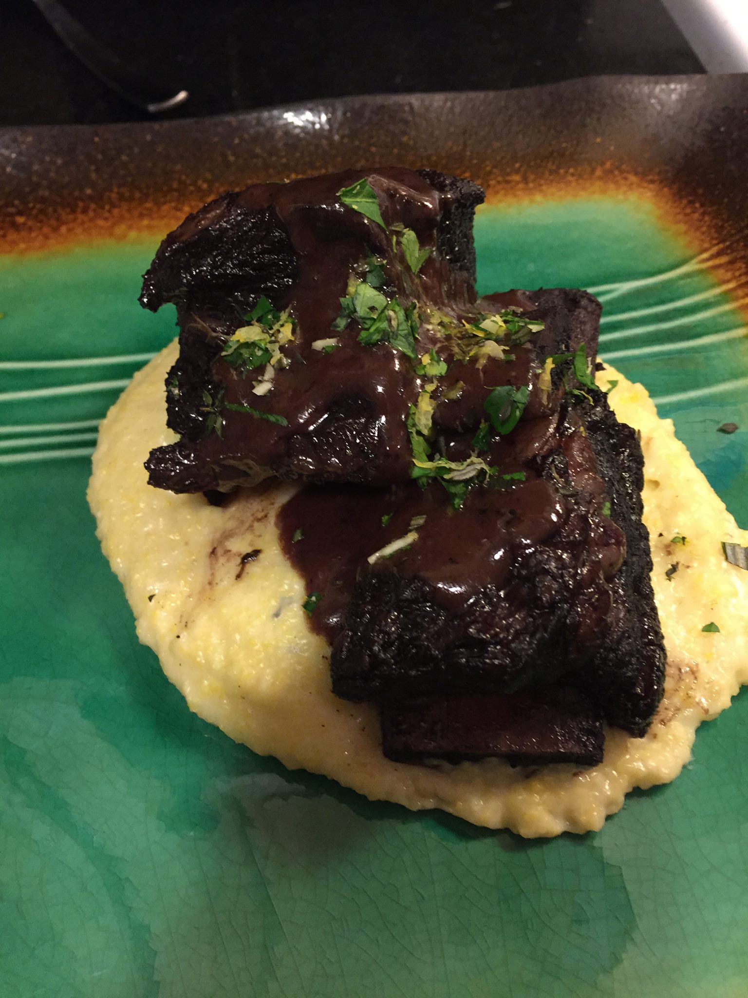 braised short ribs on a bed of polenta w/ a mixed