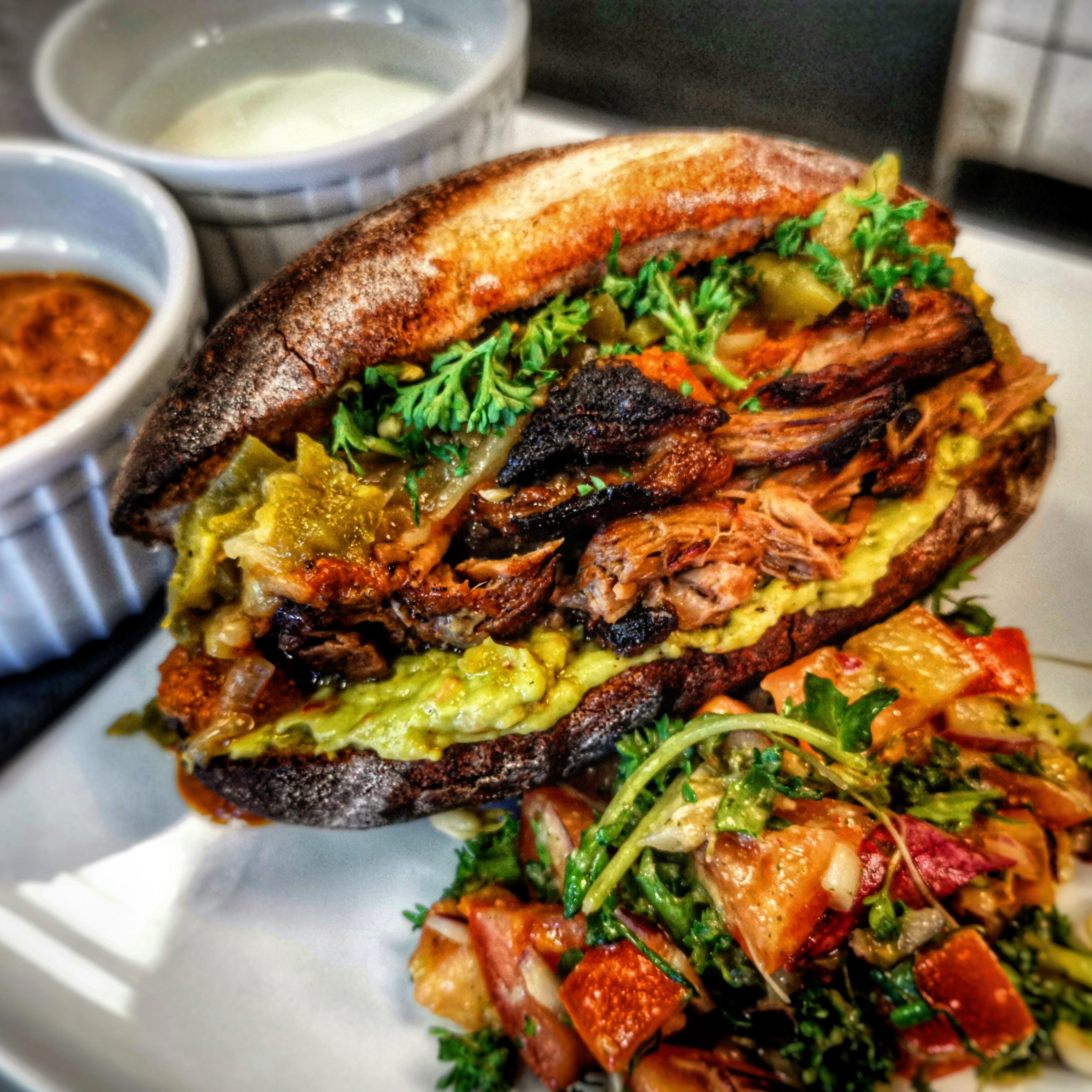 Non drenched torta ahogada, guacamole, caramelized onions