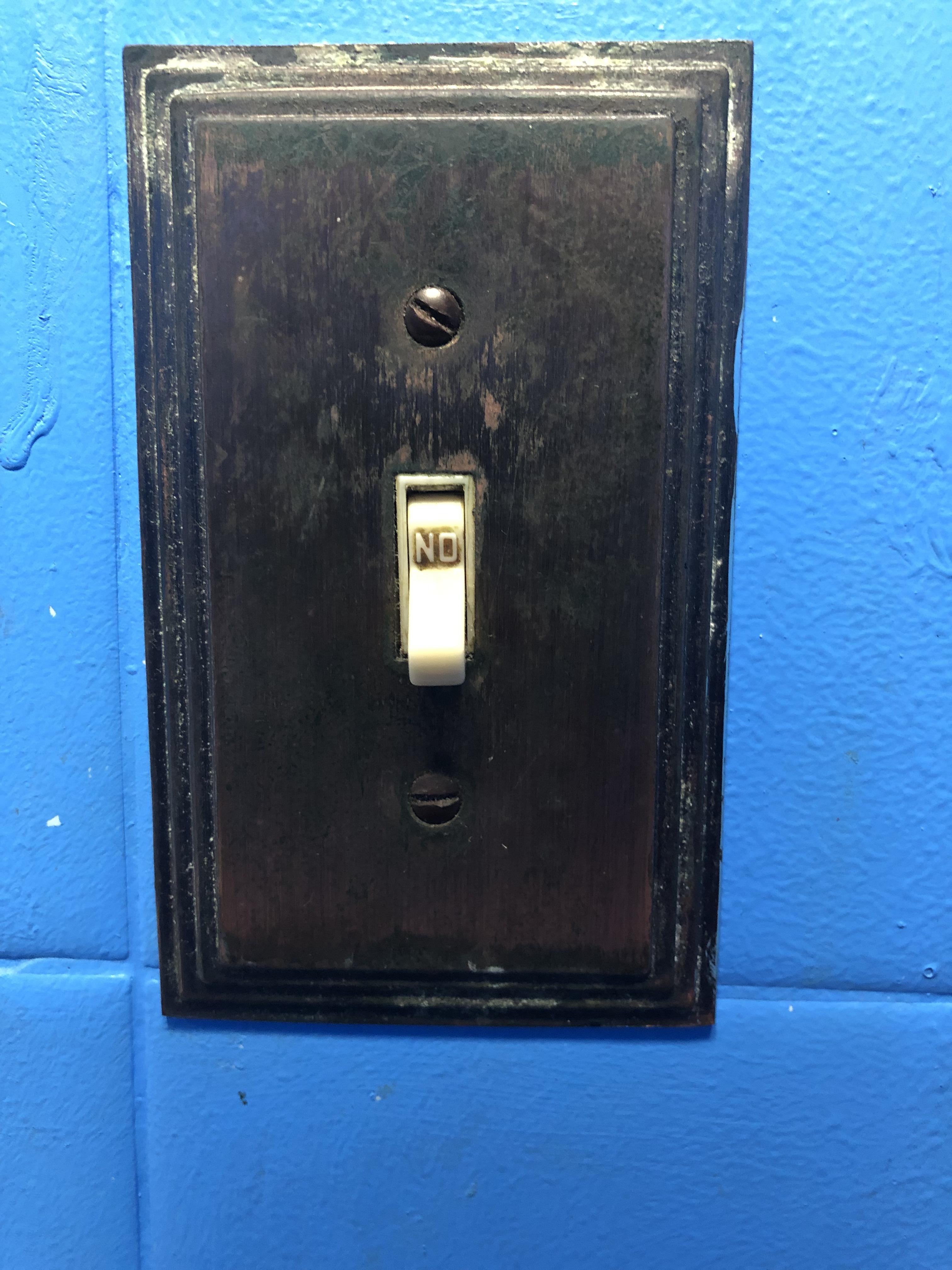 This light switch was installed upside down so now it just says “NO