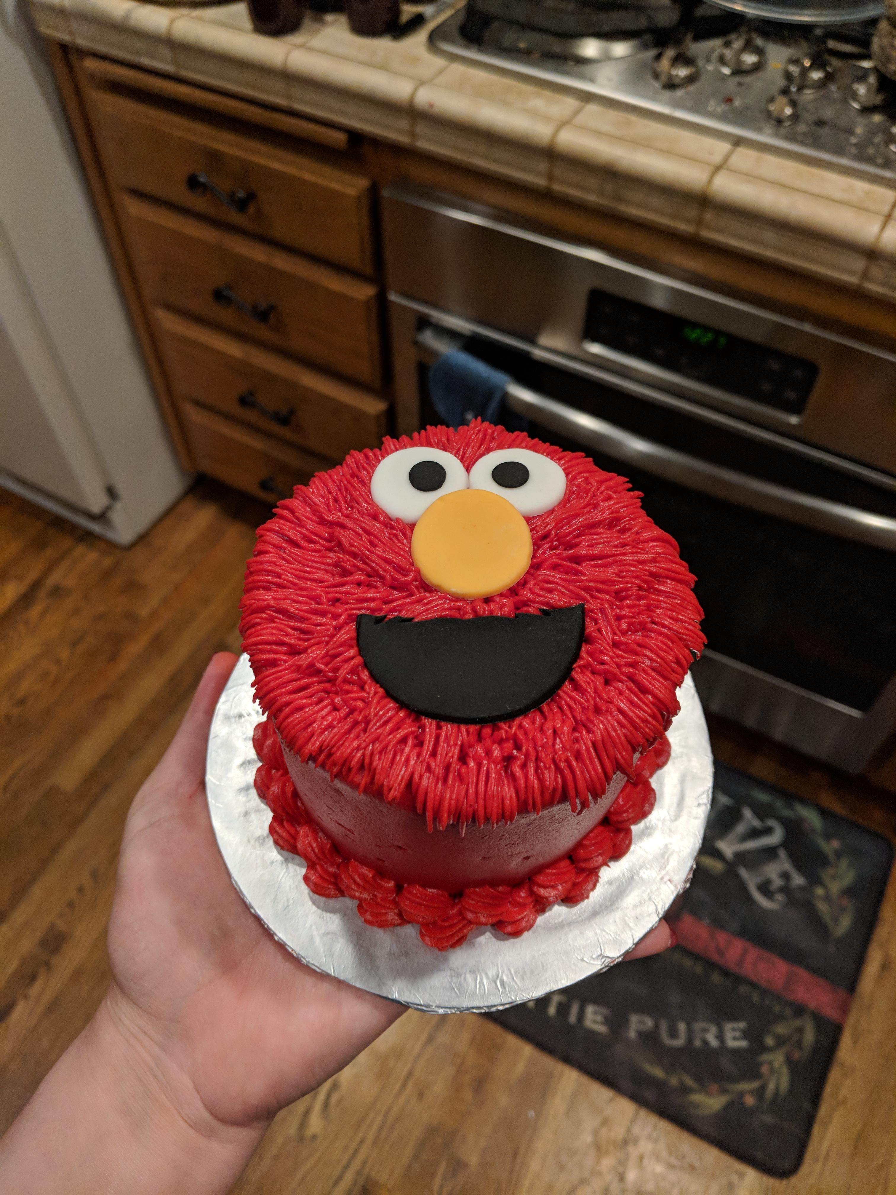 Elmo Smash cake! Funfetti with raspberry flavored buttercream and