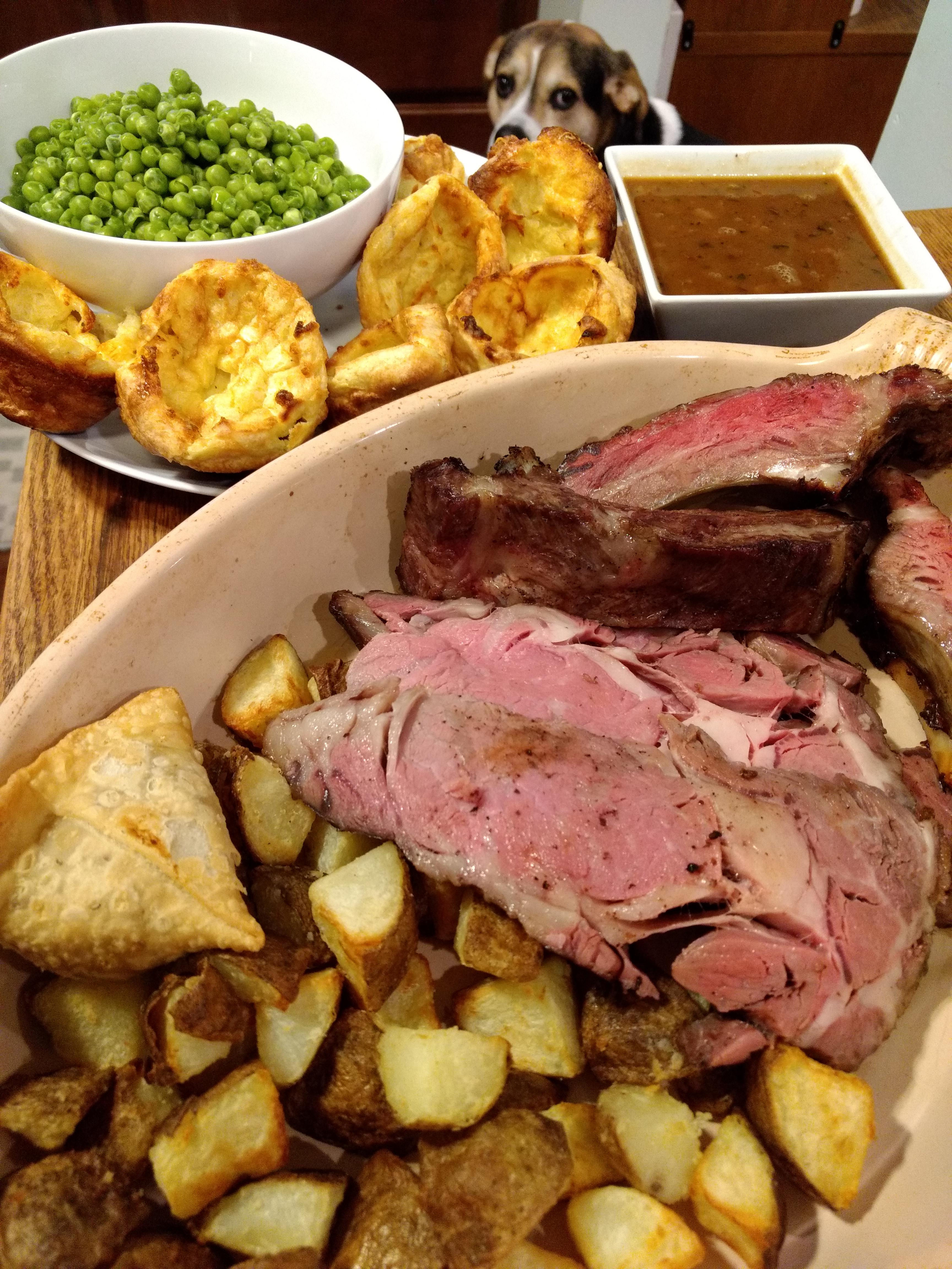 Rib roast with roast potatoes, beef gravy, parmesan Yorkshire puddings