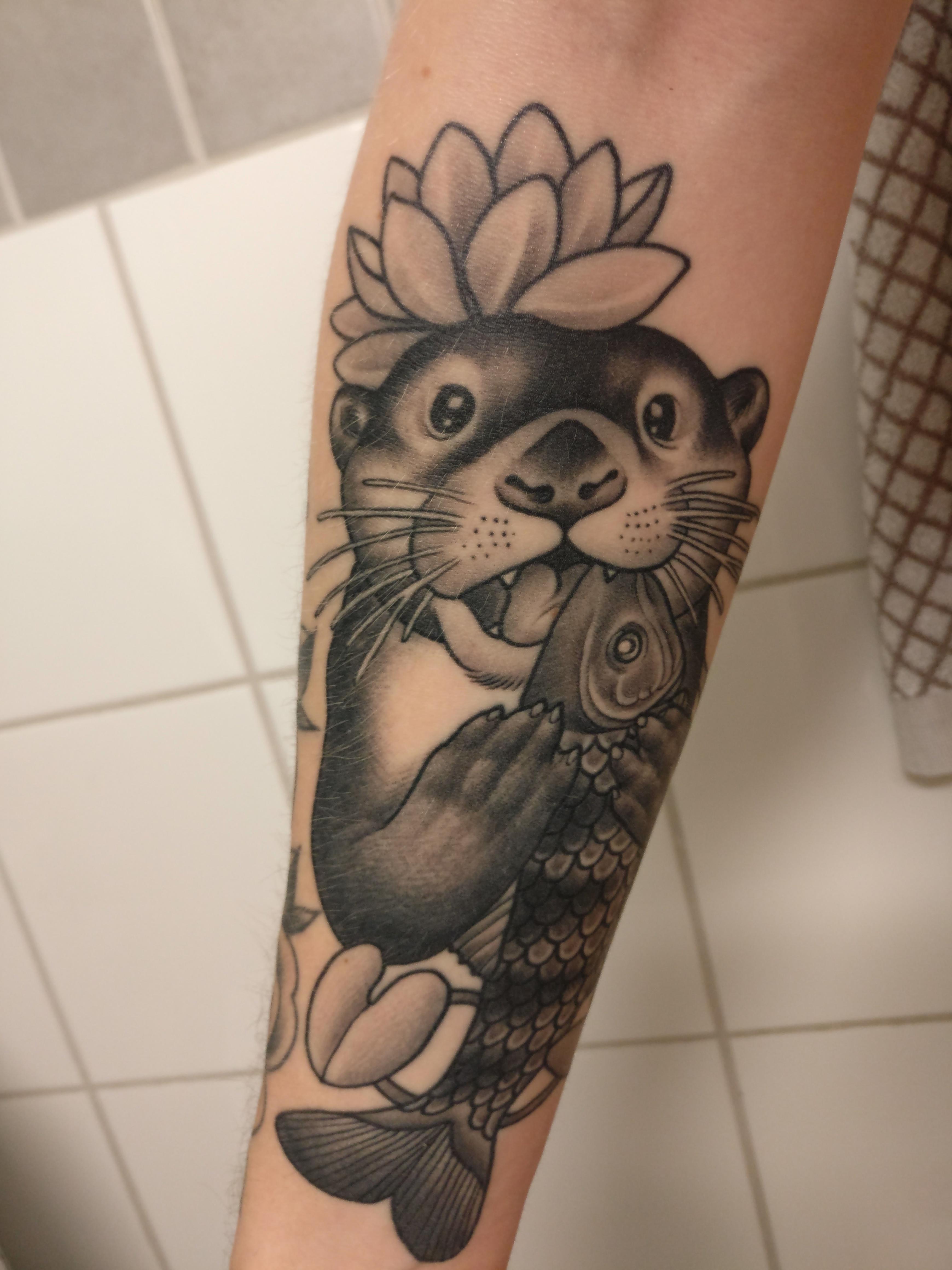 Happy otter eating a fish by Tuula Aikioniemi of Skincraft