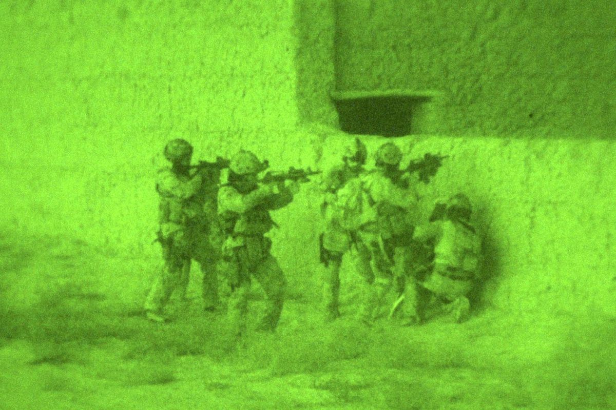A night vision photo of Canadian JTF2 operators conducting a night raid