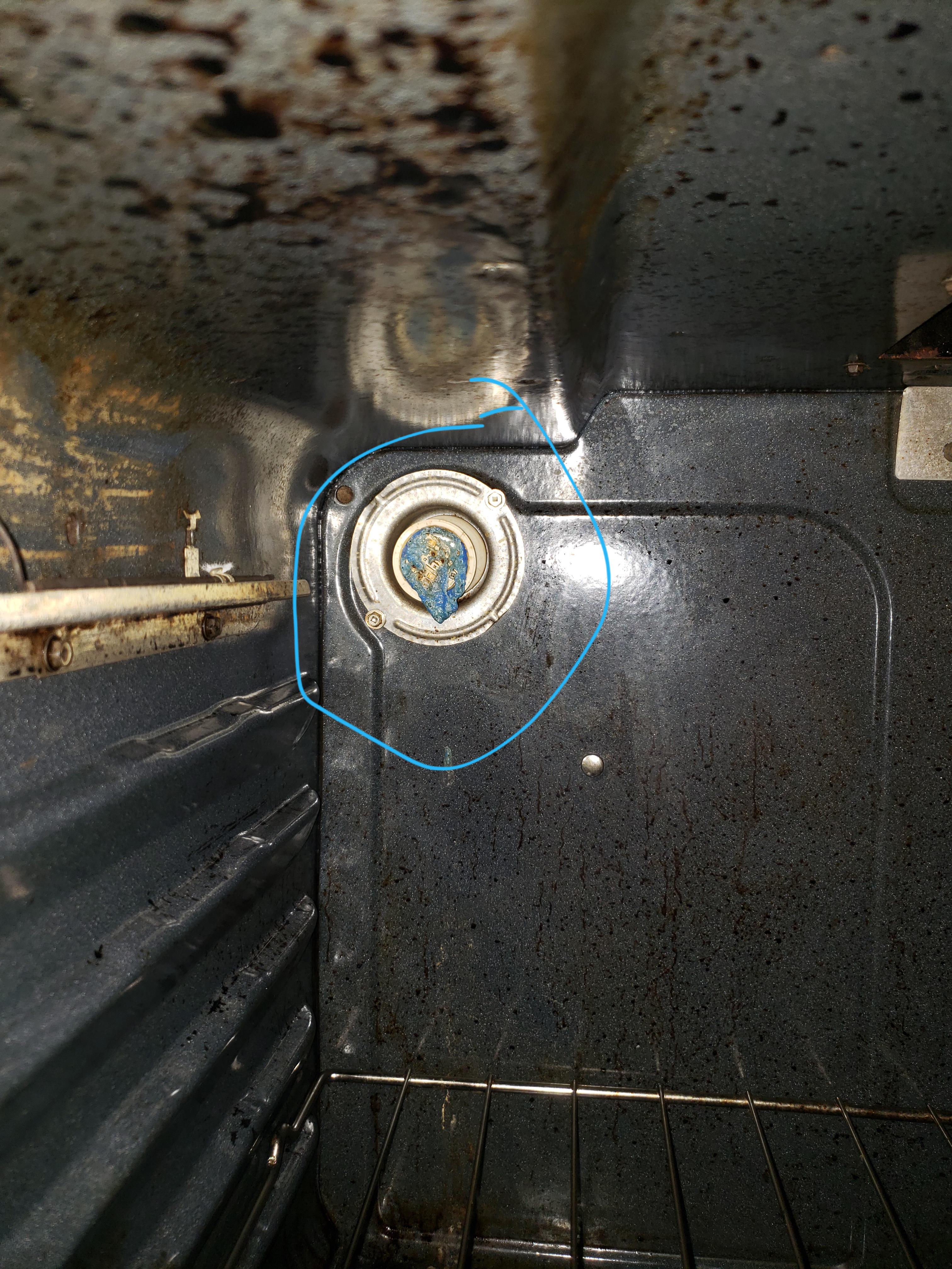 Just saw burnt cable of some sort in my new apartment's oven, is this