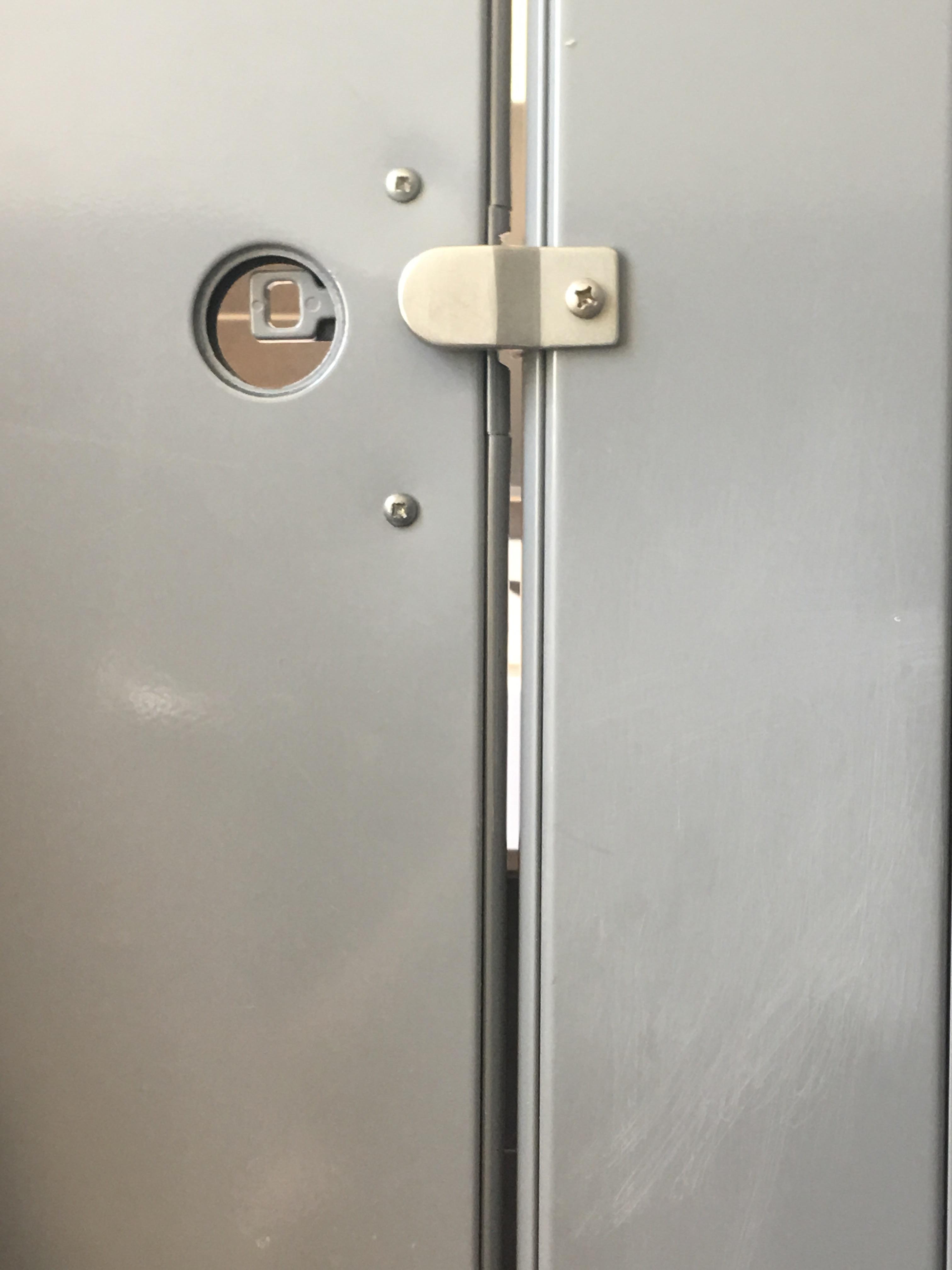 Anyone can open the bathroom stall door from the outside or peek inside