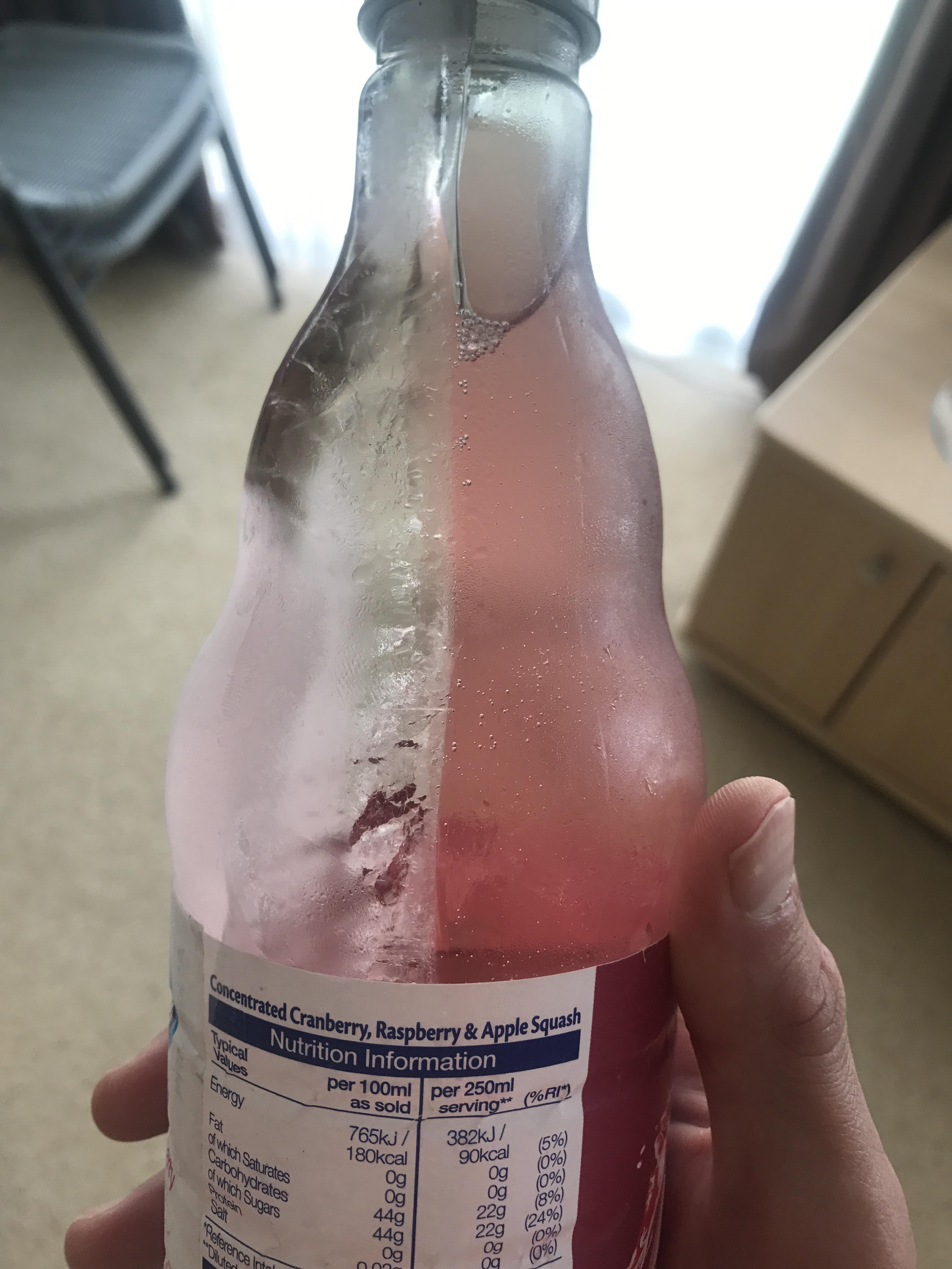 Frozen water and unfrozen juice in a bottle mildlyinteresting