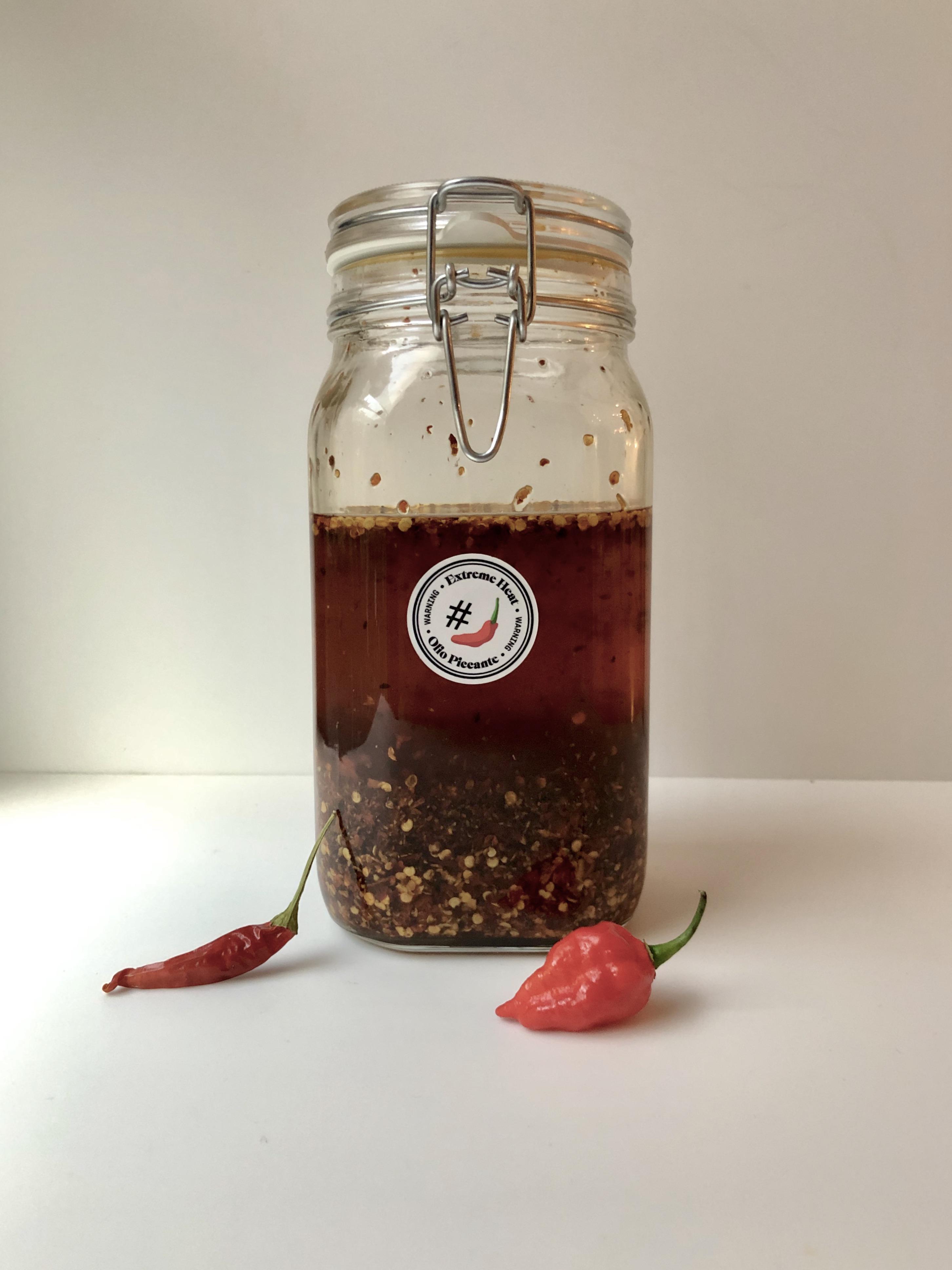 Homemade spicy olive oil with Carolina Reaper and Calabrian Peperoncino
