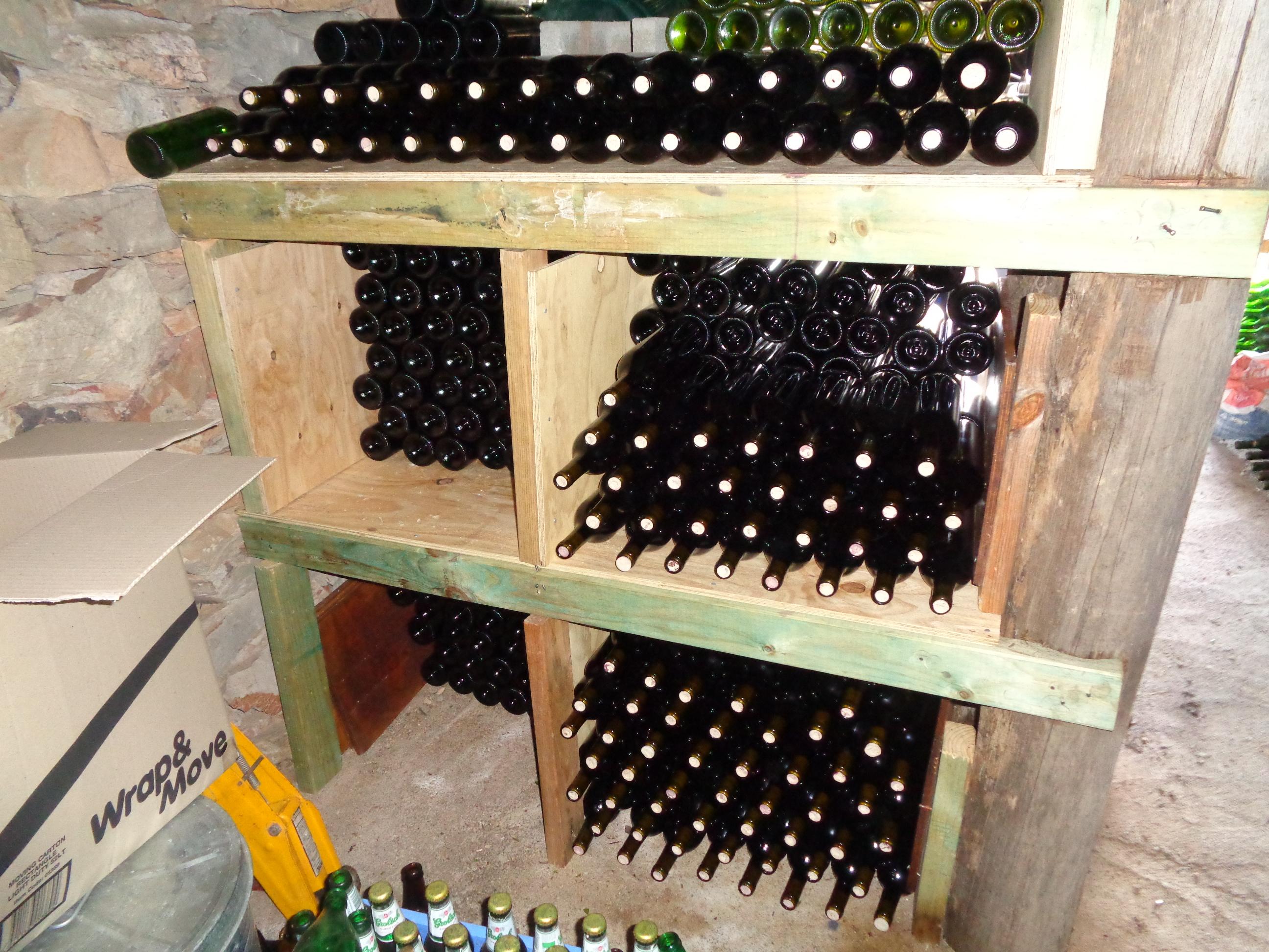 Inside the cellar, stacking the bottles. r/winemaking