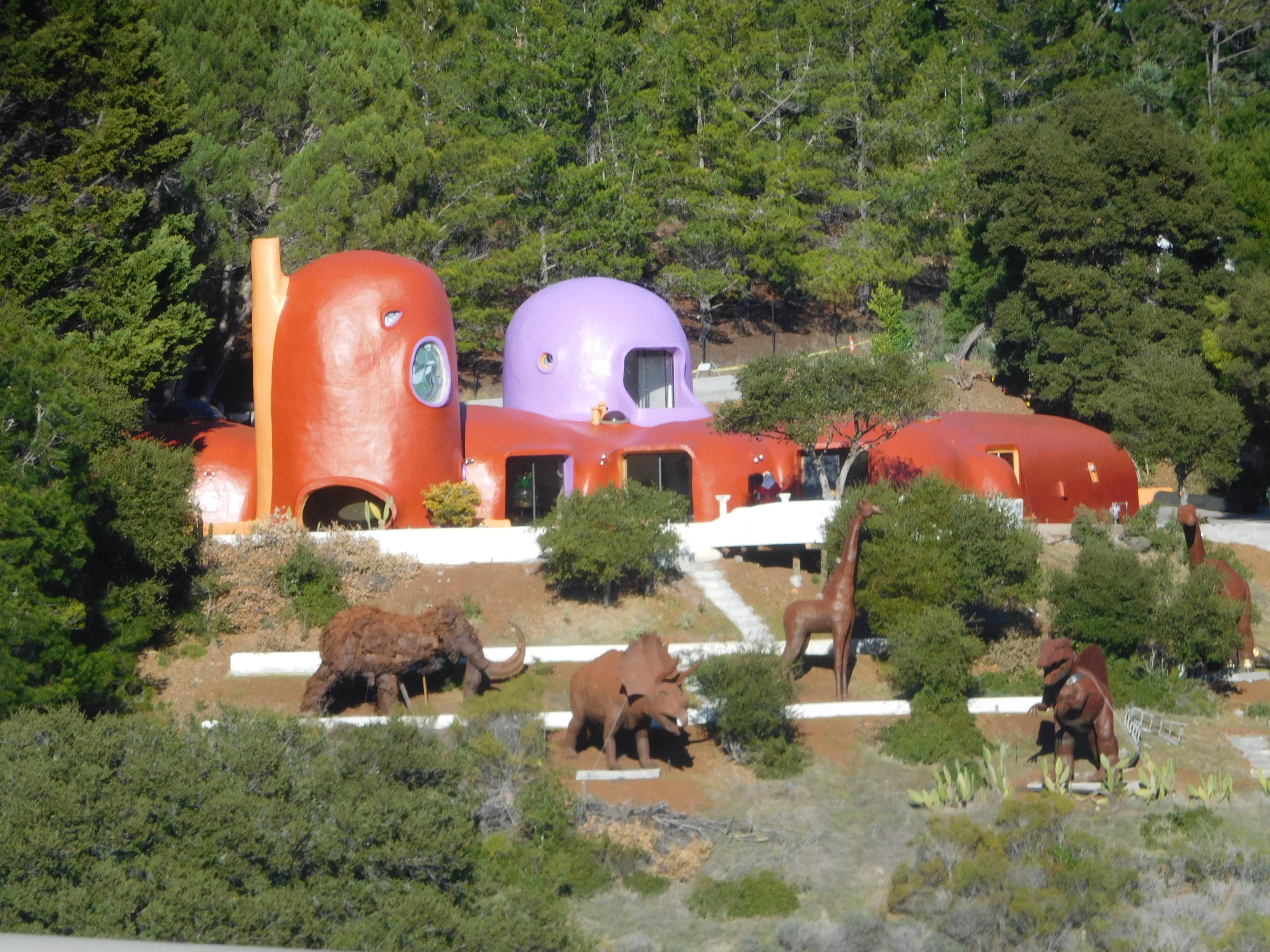 Flintstones house with dinosaurs r/pics