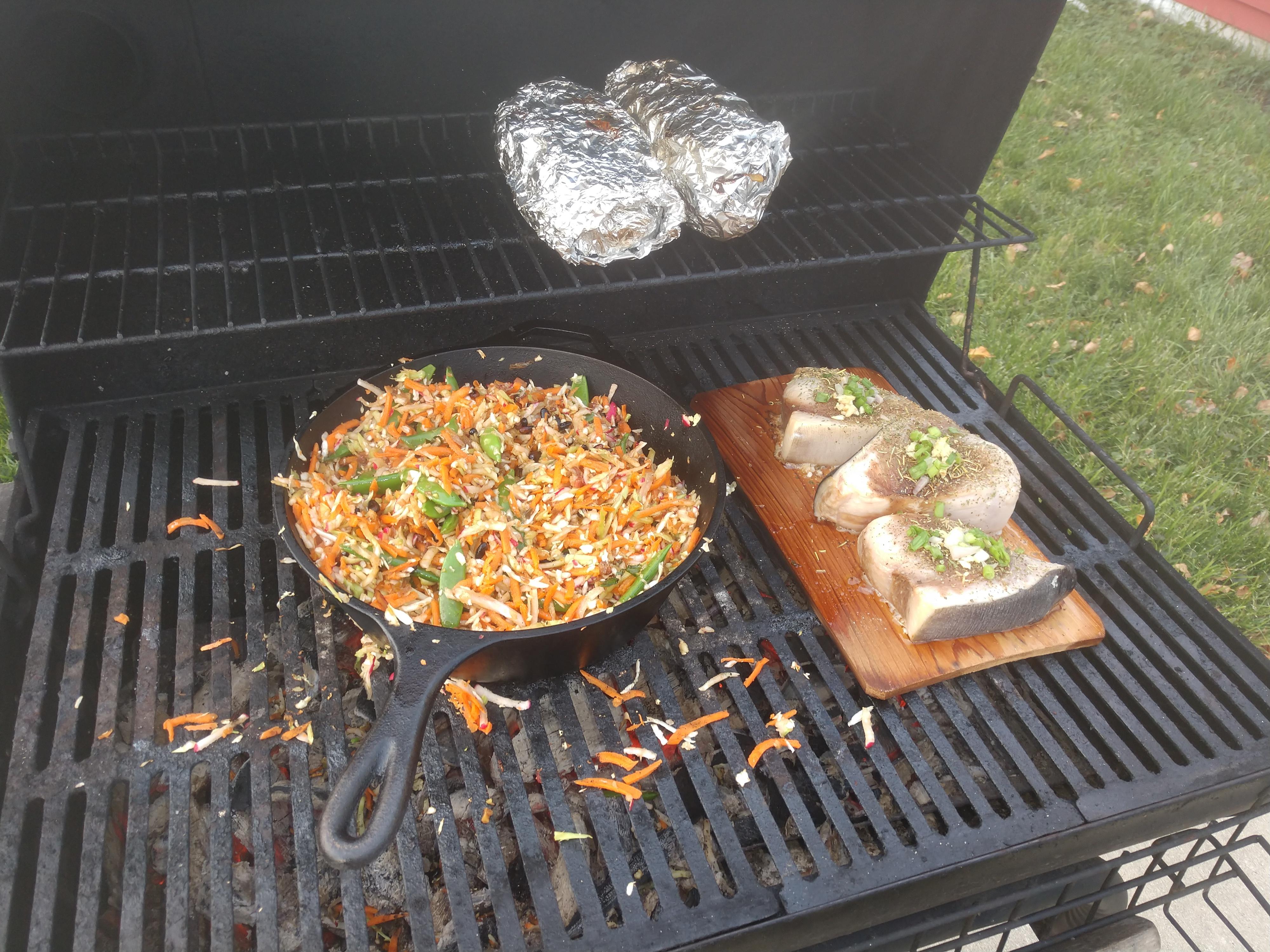 Marinated swordfish on a cedar plank; broccoli slaw with garlic