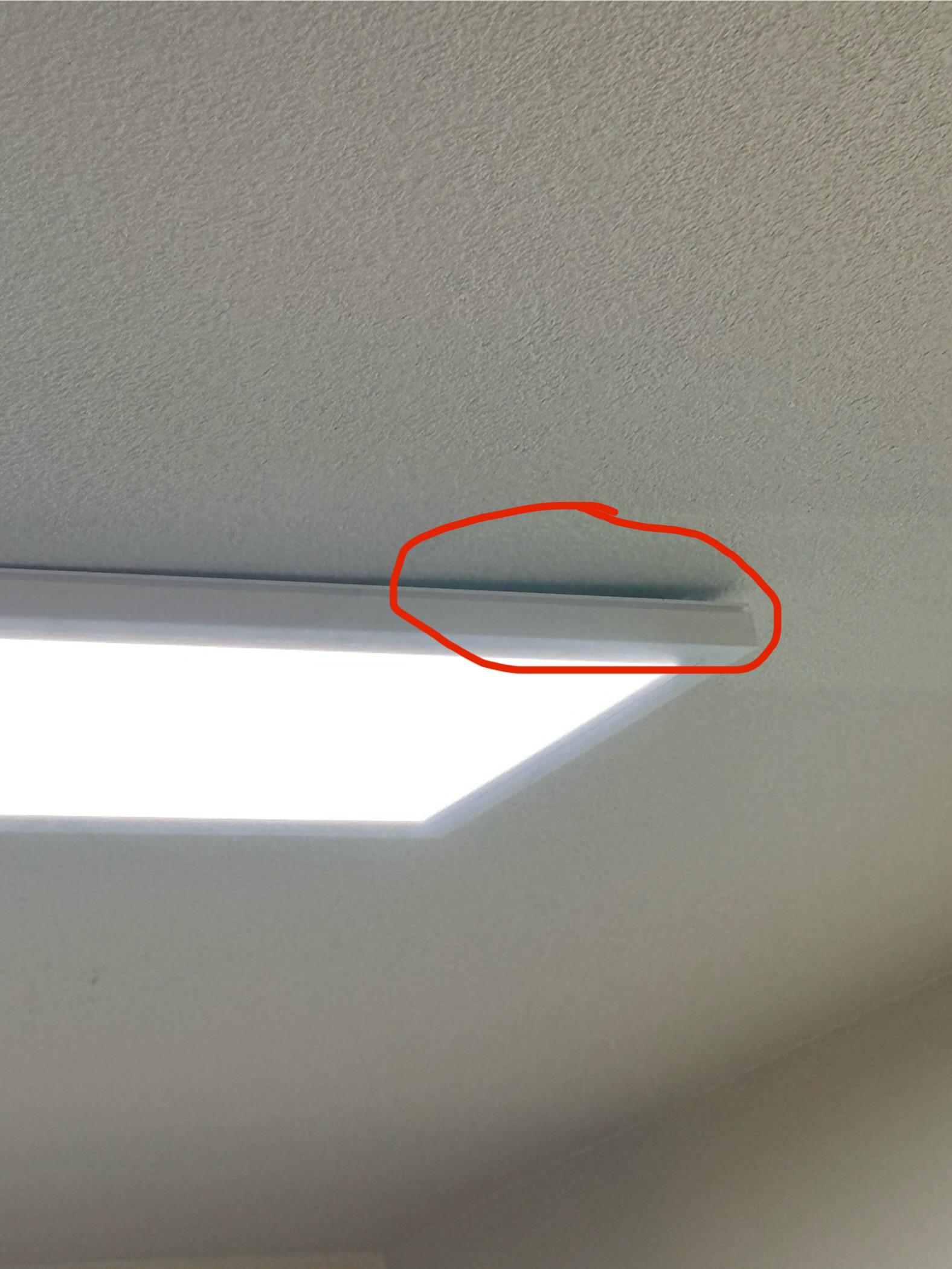 How to fix this gap between light fixture and uneven ceiling? Who to