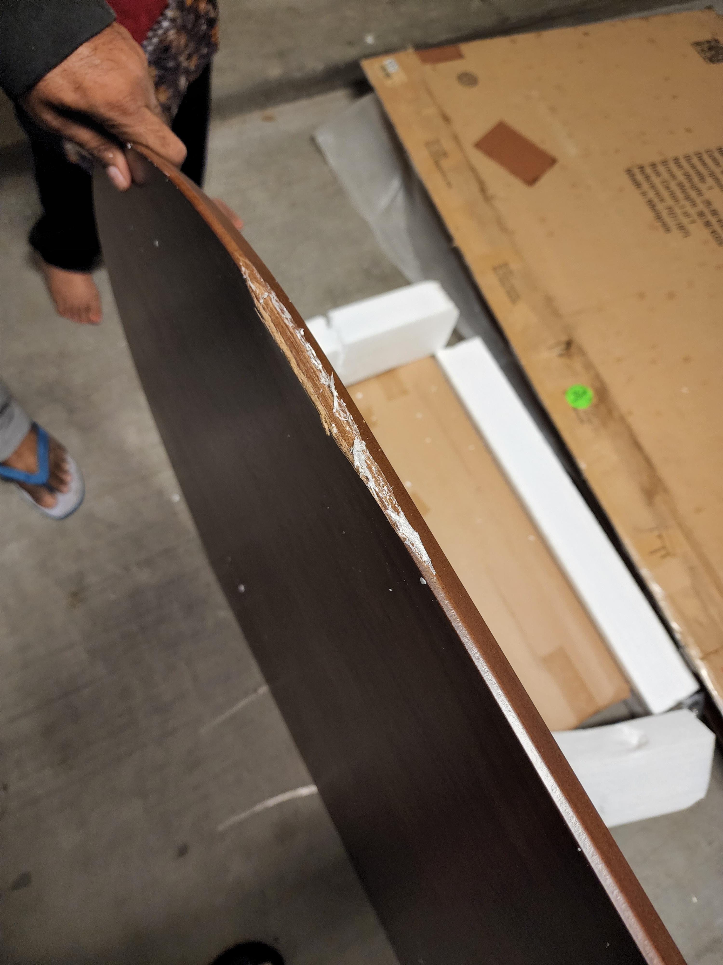 How to fix this chipped dining table that was damaged during shipping