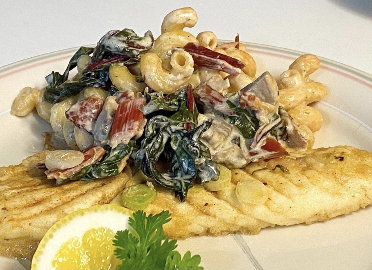 Alaskan Halibut w/ Pasta and Swiss Shard in a light cream sauce. r