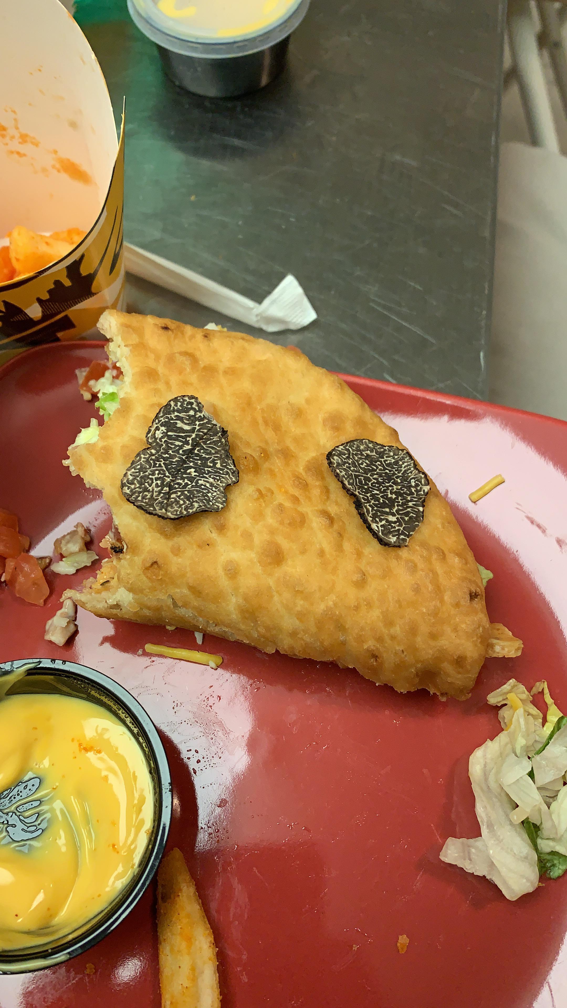 Taco Bell’s New Bacon Club Chalupa paired with a shaved winter truffle and warm nacho cheese