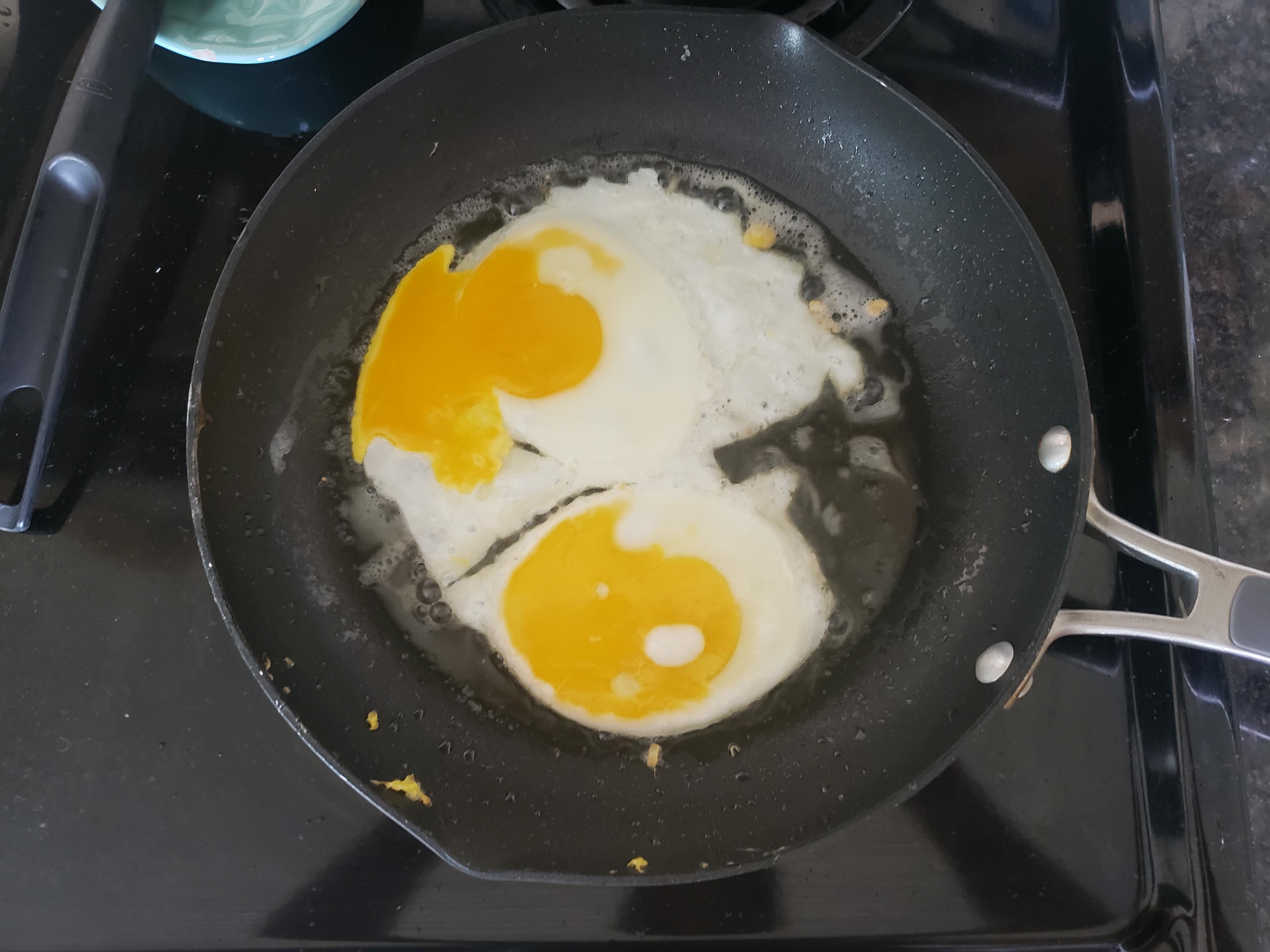 I was cooking fried eggs and the one on the bottom became a yin and